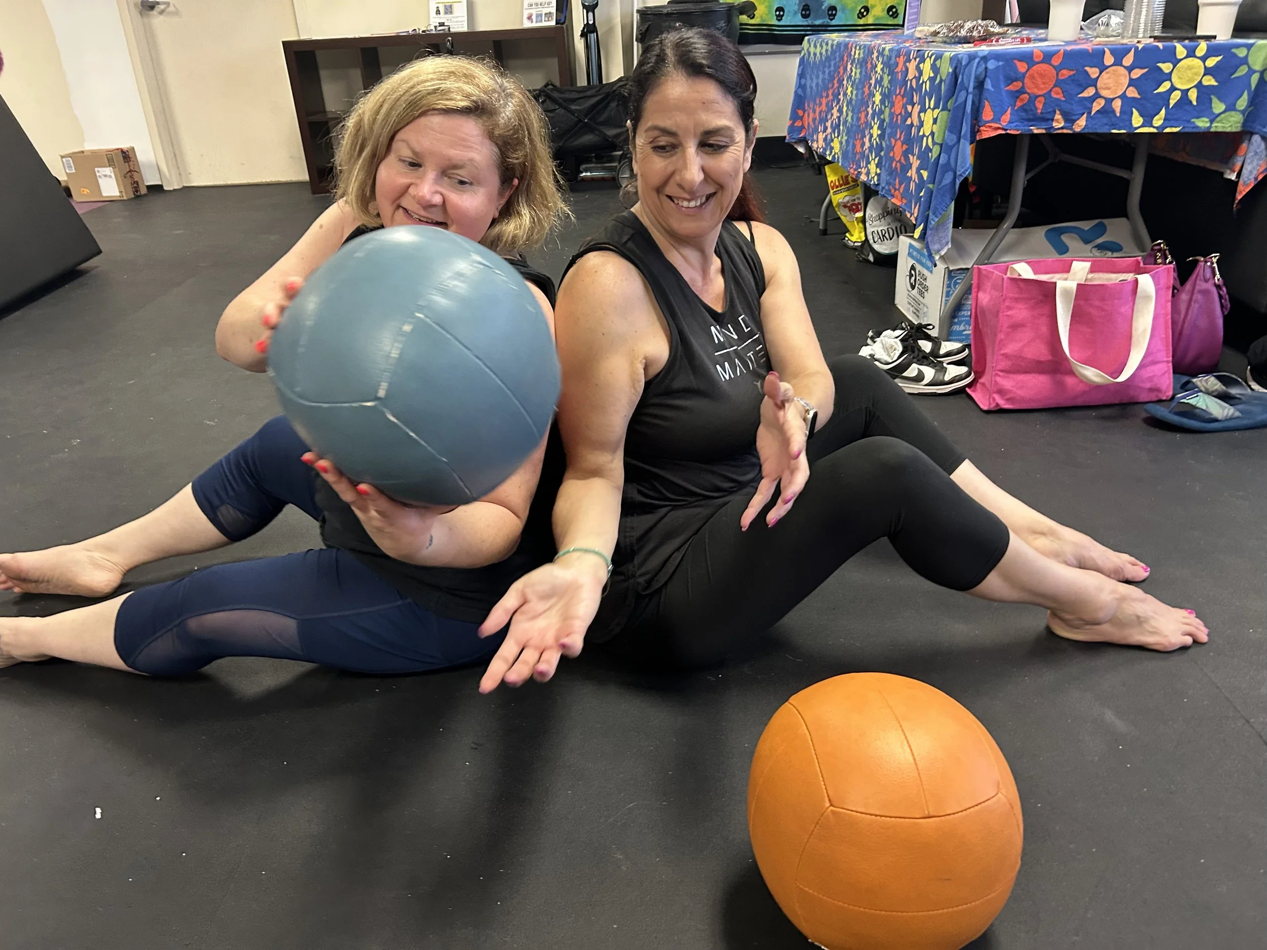 Women working out together mindfully at Yoga Mouth Collective.