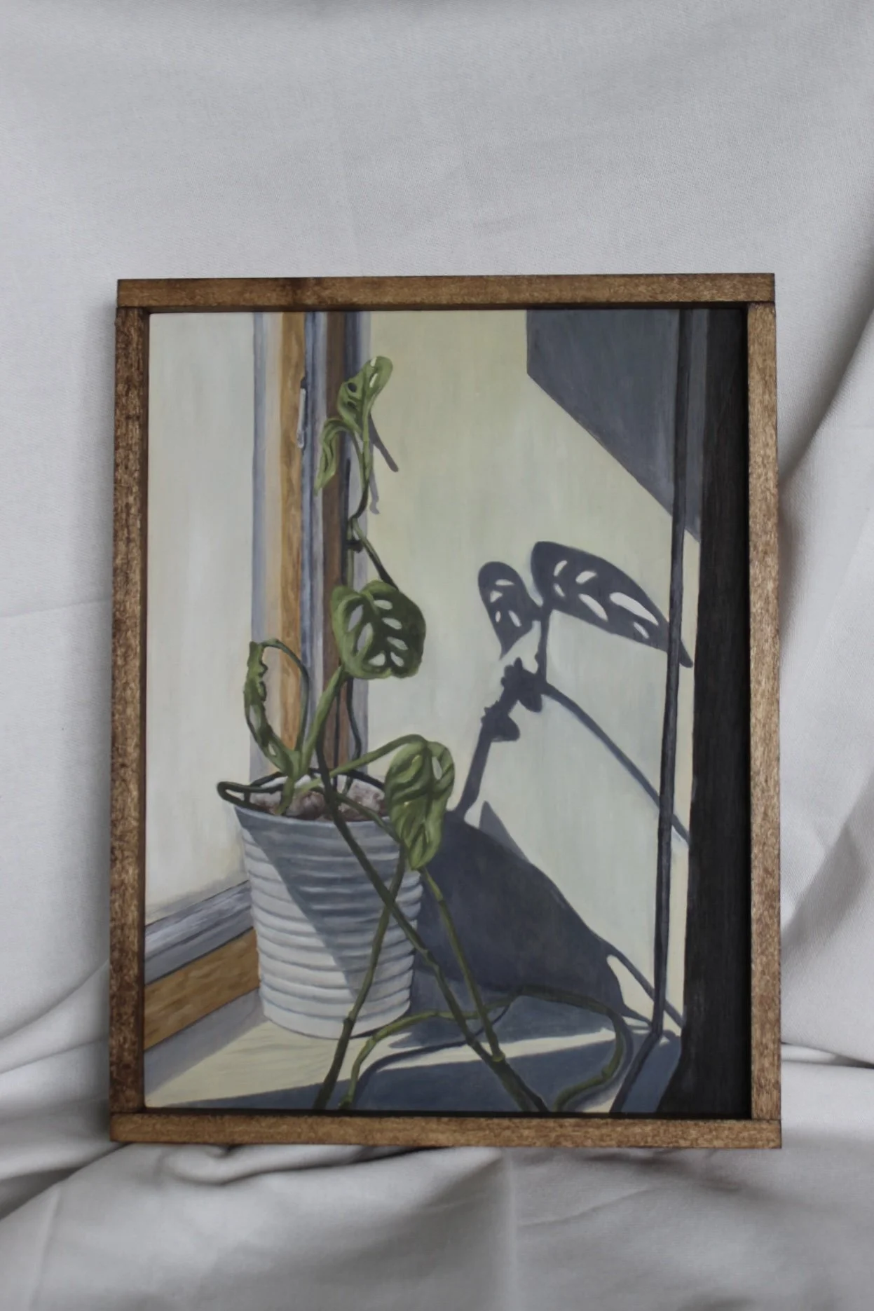 painting of four eggs in a bowl with a wooden frame