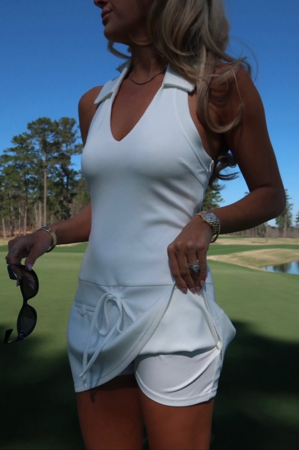 The Fairway Collared Romper in white with a halter top and drop-waist details | House of Duke