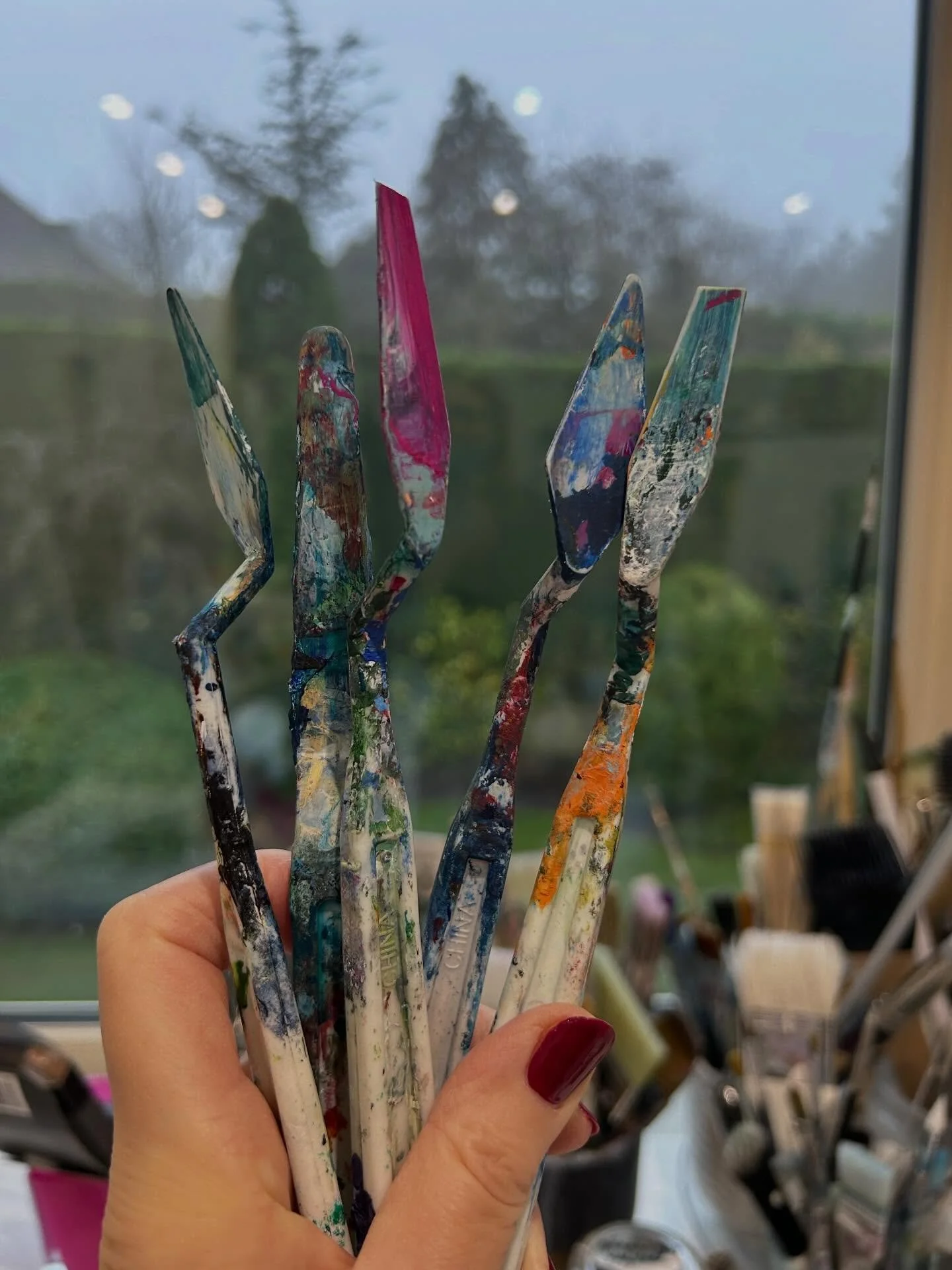 My well-used palette knives stained, scarred, and two with broken tips.
Years of mixing paint 
These are my palette knives used only to mix my colours. 
I can&rsquo;t help wondering&hellip;
Did those tiny pieces disappear into a mix ?
Are they buried