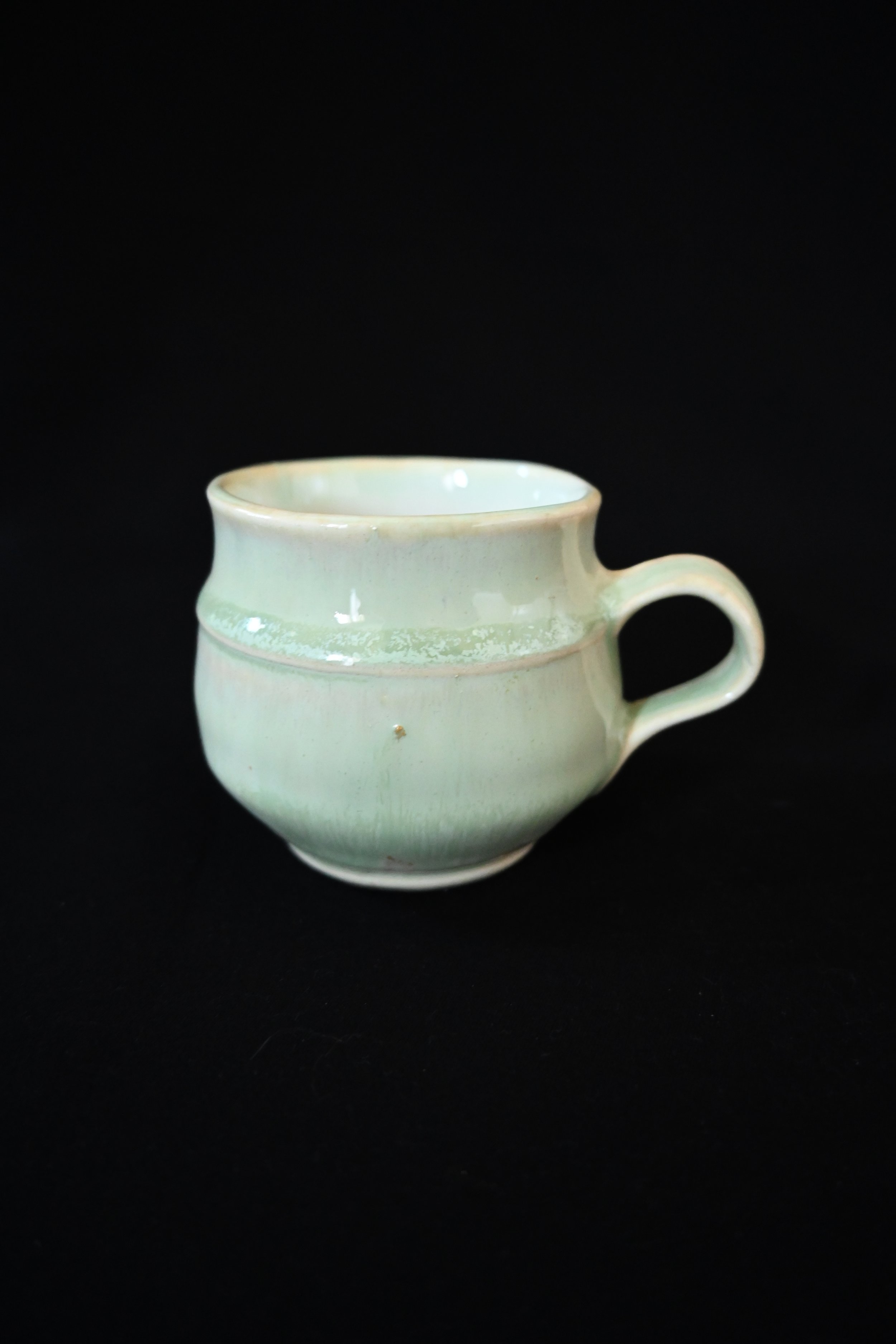 Handthrown light Green Espresso Cup with ears.jpg