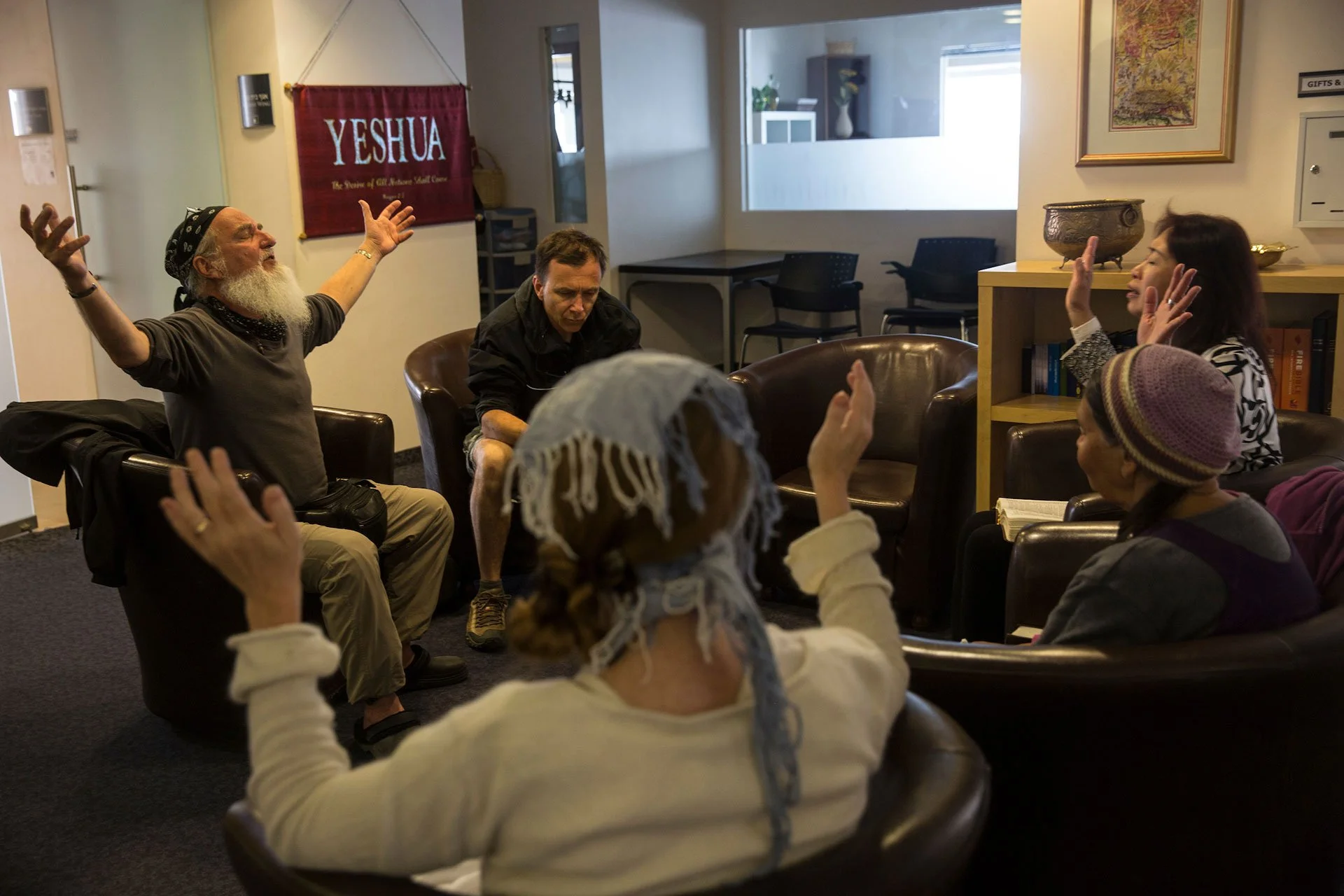 Christian worshiper Kevin Burner, 60, from Spencer,MA (left) with Christian worshippers at the prayer hall of the Kings of Kings Church in downtown Jerusalem on March 30,2018. Burner was in the US Airforce and then was a Pastor in California. (Photo 