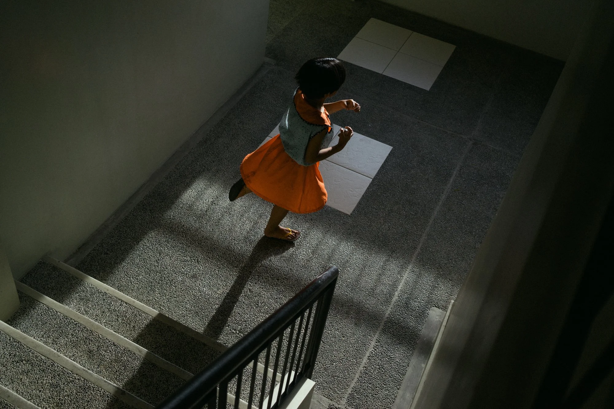 A 10-year-old child runs in a halfway house for sex trafficking victims outside of Manila.