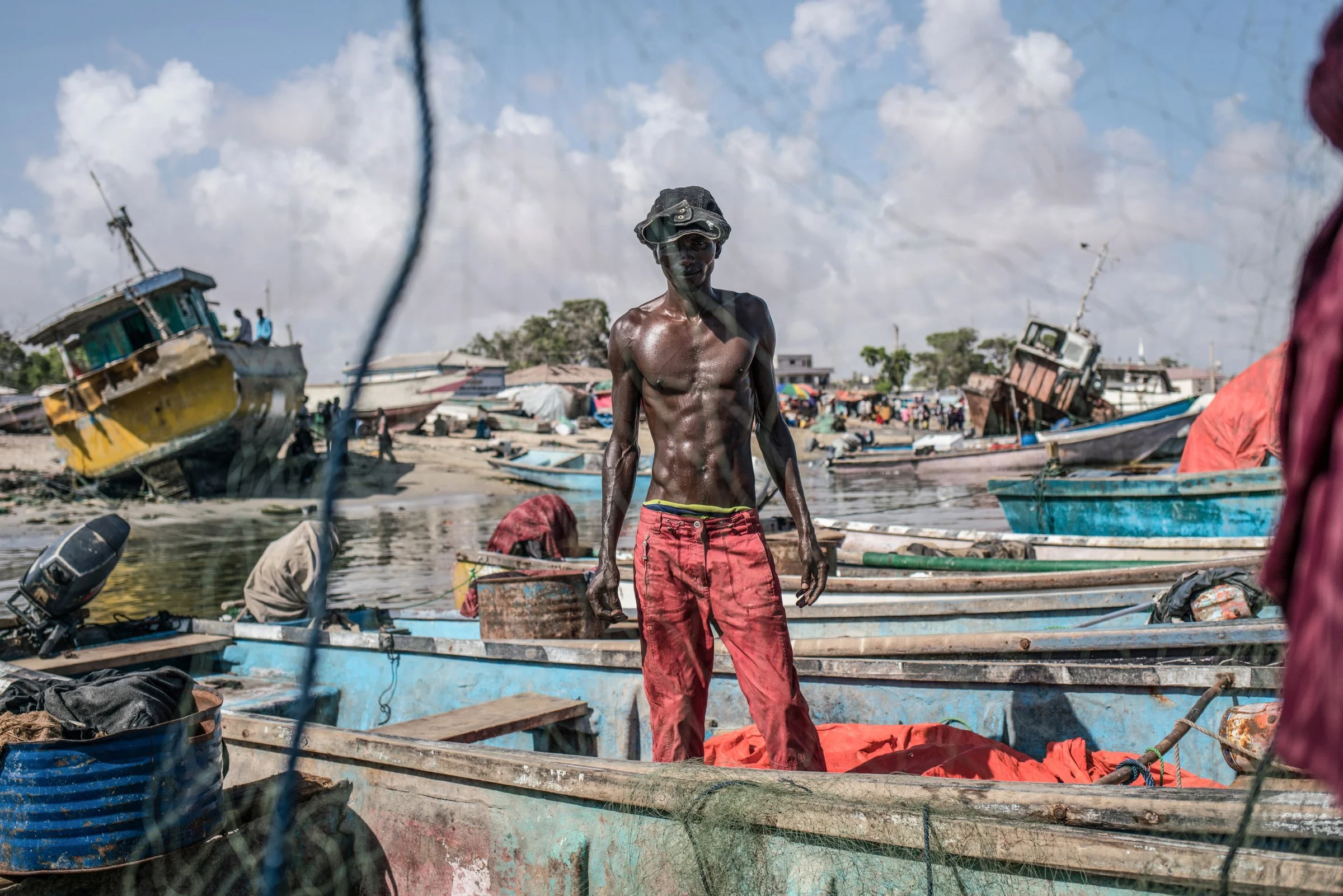 Fishermen untangle their nets in the port of Bosaso, the largest city in Puntland. 