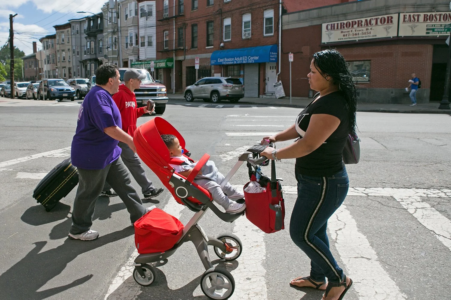 Pedestrians walk in East Boston on June 9, 2016. 
