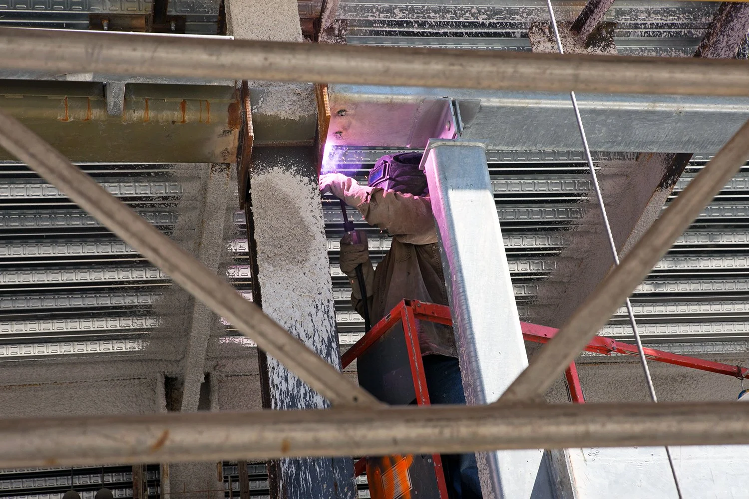 Welder Steve Makein works on a new building on the South Boston waterfront, Monday June 6, 2016. 