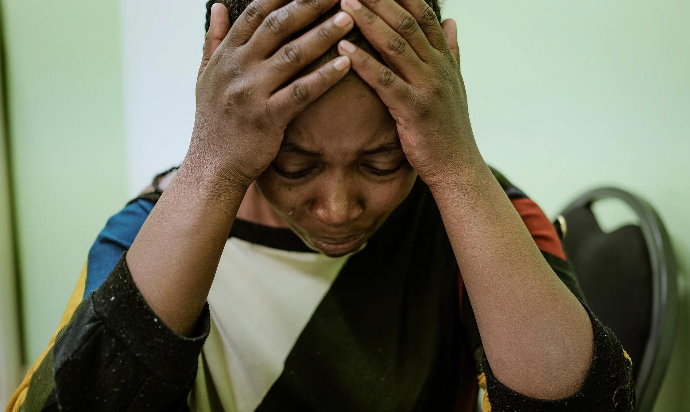  At the Gender Based Violence Unit in Windhoek, Sara, 28, cries while describing the physical abuse she endured at the hands of her husband. In Namibia, one in three women will report gender-based violence in her lifetime. (Photo by Asha Stuart/Groun