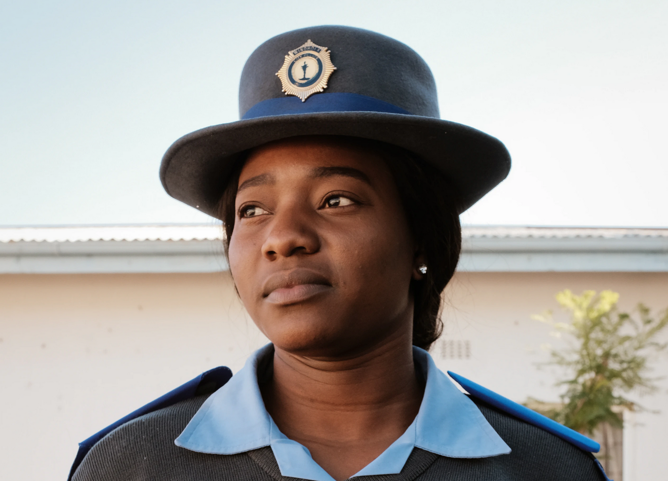  Officer Nomboga poses for a portrait in her Namibian policewoman’s uniform in Windhoek, Namibia. (Photo by Asha Stuart/GroundTruth) 