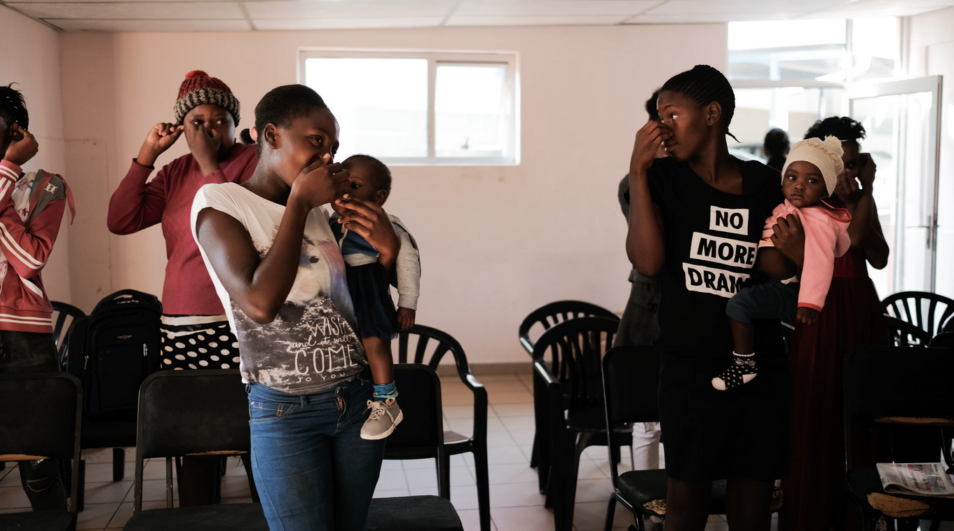  Young women bring their children to a DREAMS HIV education session. While mother-to-child transmission of HIV stands at 4 percent in Namibia, the rate has steadily been decreasing due to the country’s strategic outreach programs. (Photo by Asha Stua