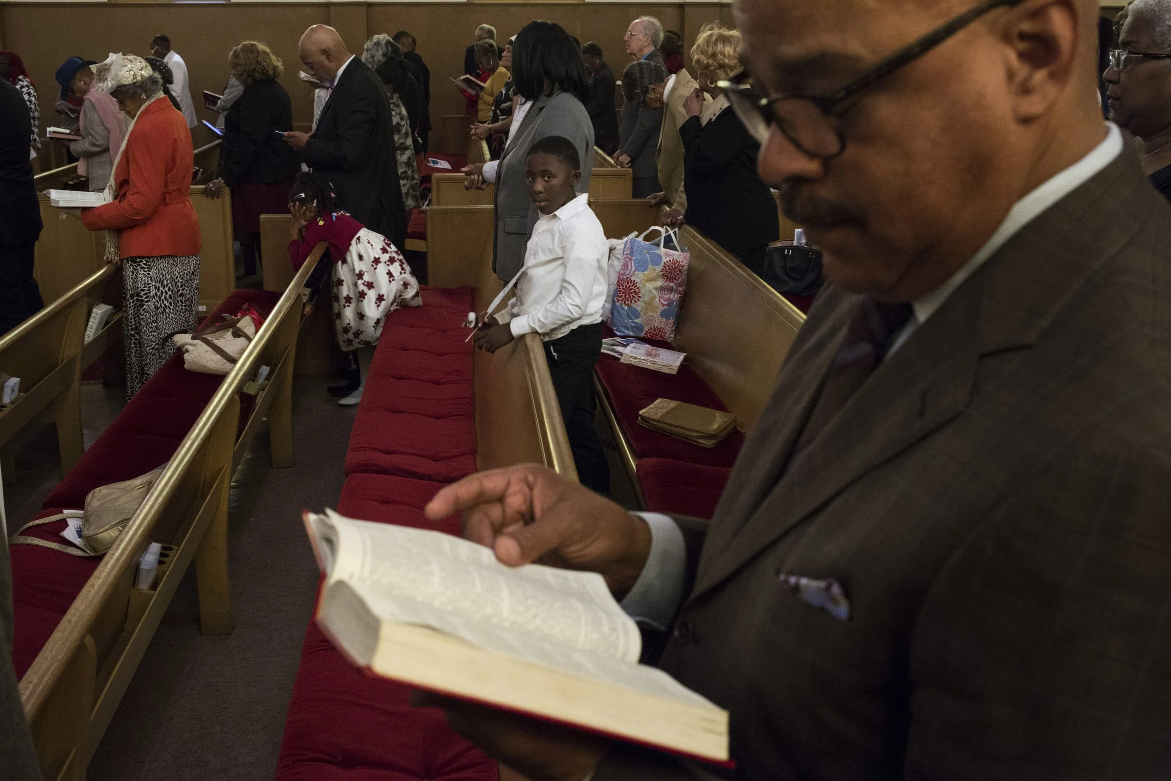  A young boy sits through the sermon at the Third Baptist Church in the Fillmore district of San Francisco, California, on Sunday, November 5, 2017. (Photo by Brittany Greeson) 
