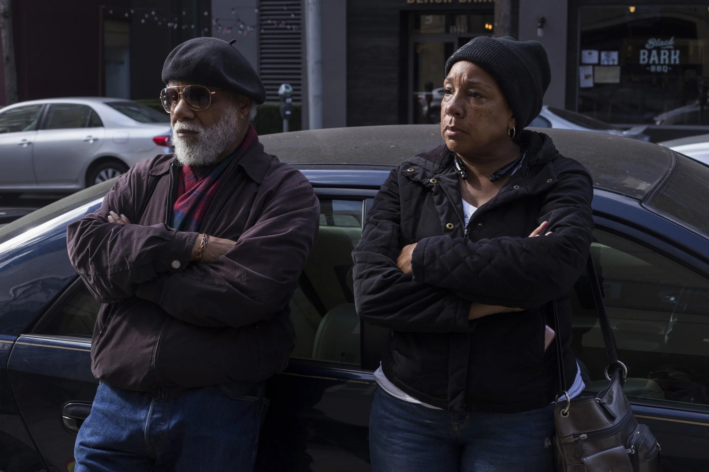  Local salon owner Paulet Gains and local resident Terry Collins, 81, quietly listen to speakers during a public rally held by The New Community Leadership Foundation in the Fillmore district of San Francisco, California, on Thursday, November 2, 201