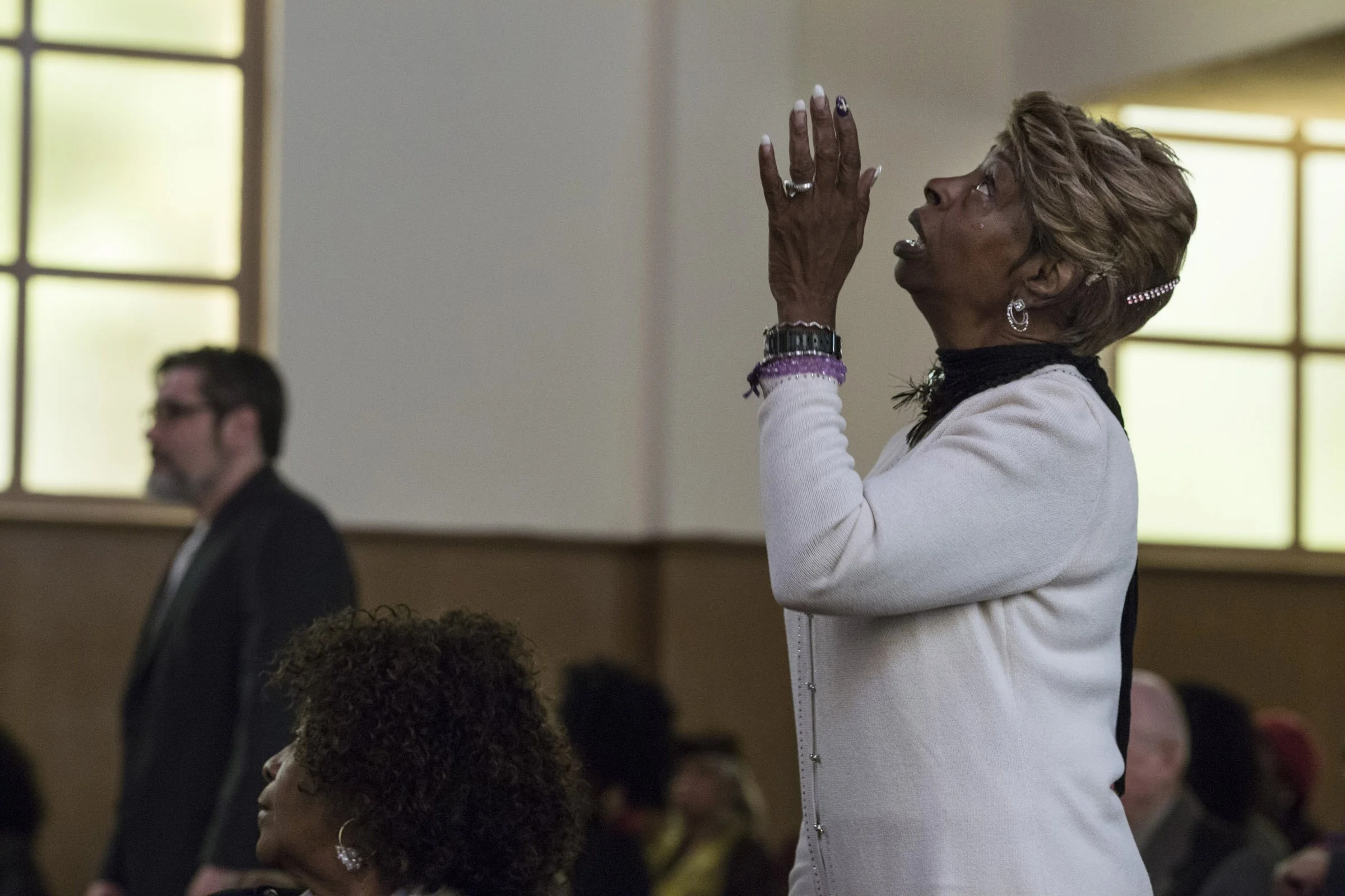  Elaine Buchanan, raises her hands in praise during the service at the Third Baptist Church in the Fillmore district of San Francisco, California, on Sunday, November 5, 2017. (Photo by Brittany Greeson) 