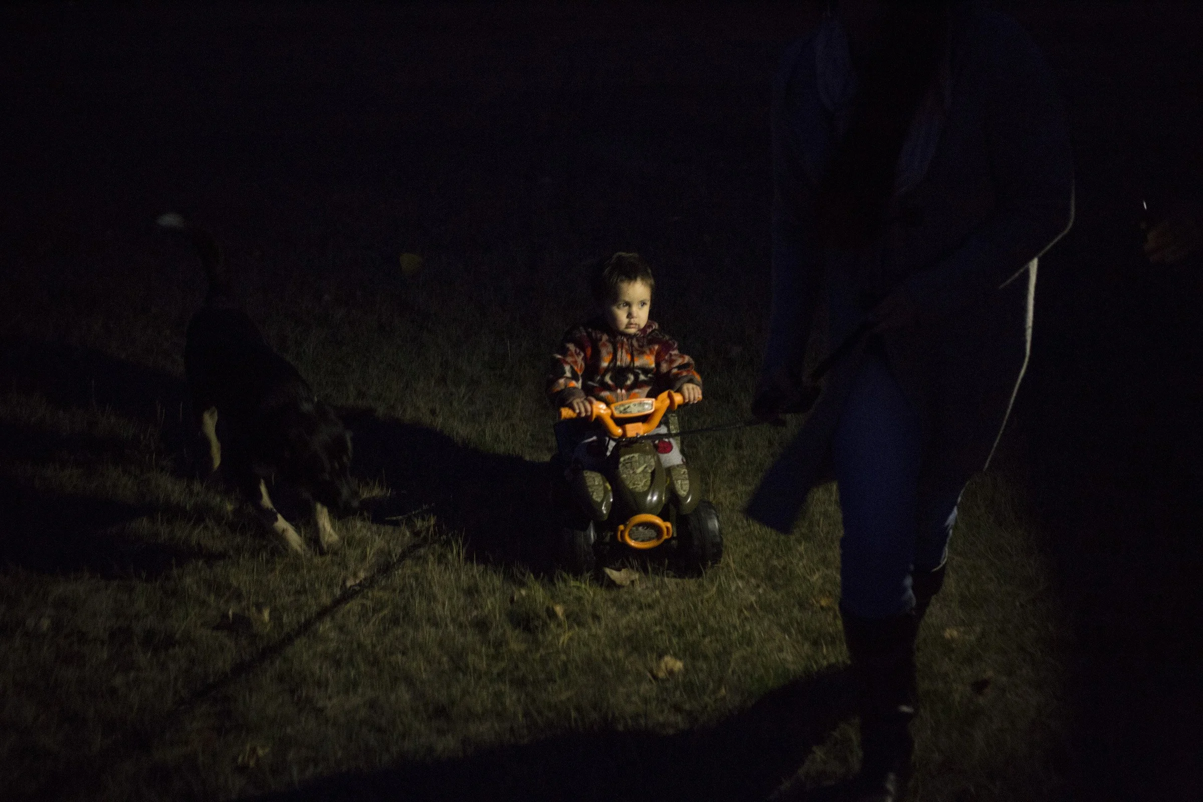  Niste Omeasoo, 2, is pulled across his yard on a tricycle by his grandmother, Susie Boushie, 37, in, Pablo, Montana, on Sunday, October 22, 2017. (Photo by Brittany Greeson) 