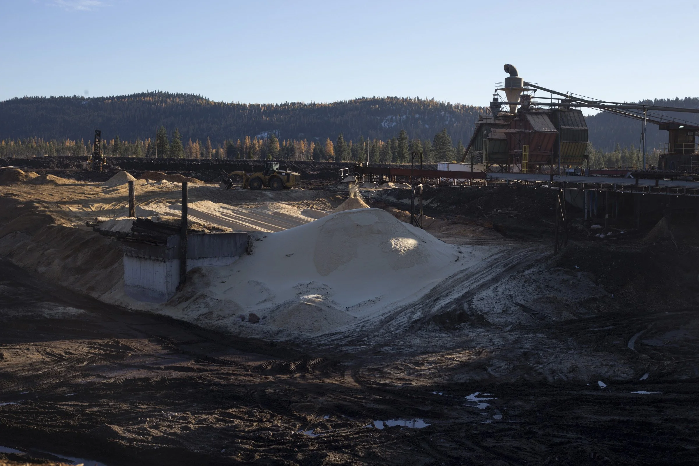  A mountain of sawdust collects from a chute at Pyramid Mountain Lumber Inc., in Seeley Lake, Montana, on Thursday, October 29, 2017. (Photo by Brittany Greeson)= 