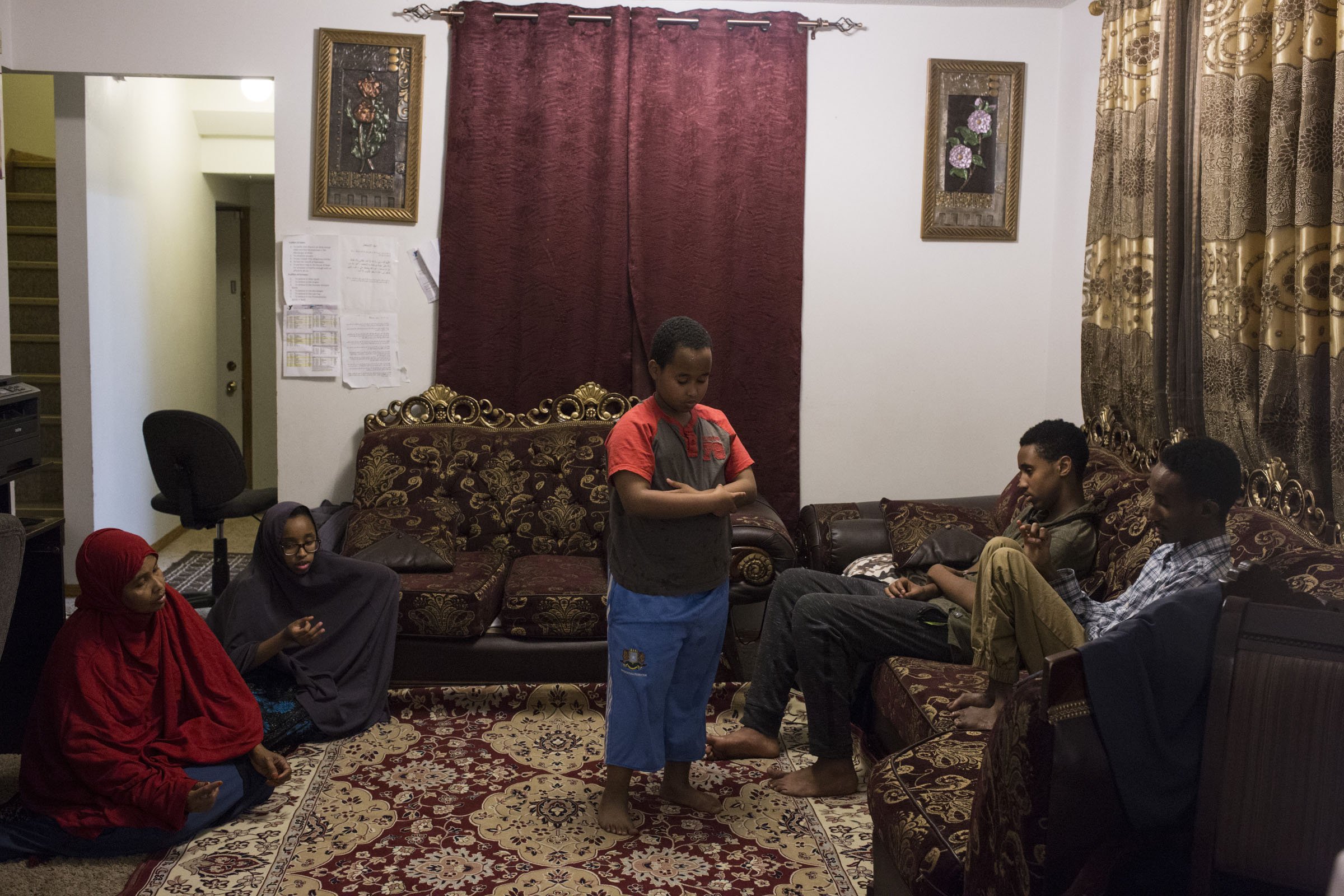  Abdullah Mohamud, 8, does his evening prayer solo after the other members of his family have wrapped up with their evening prayer at their home in Minneapolis, Minn., on Thursday, October 12, 2017. (Photo by Brittany Greeson) 