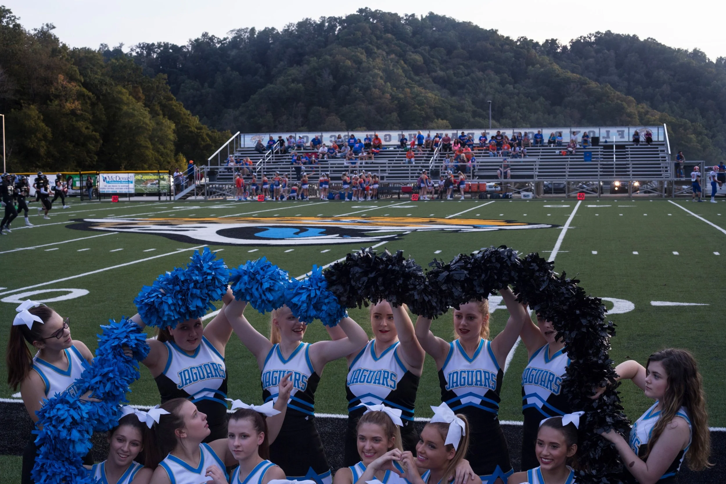  Floyd Central High School cheerleaders form their pom-poms into a heart shape for a group photo before a football game in Langley, Kentucky, on Friday, September 22, 2017. (Photo by Brittany Greeson) 