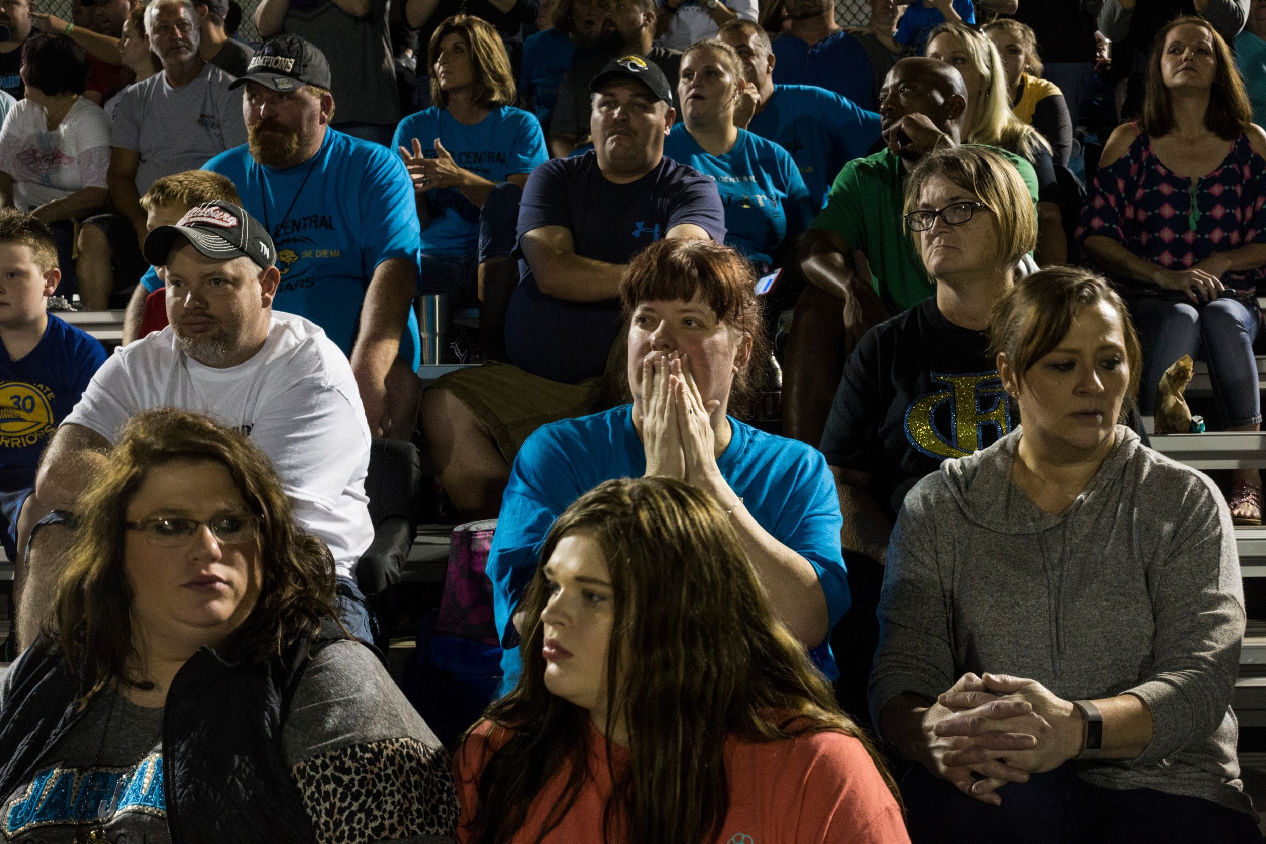  Angie Heard Minnie, center, watches intently as a play is made during a close football game at Floyd Central High School in Langley, Kentucky, on Friday, September 22, 2017. (Photo by Brittany Greeson) 