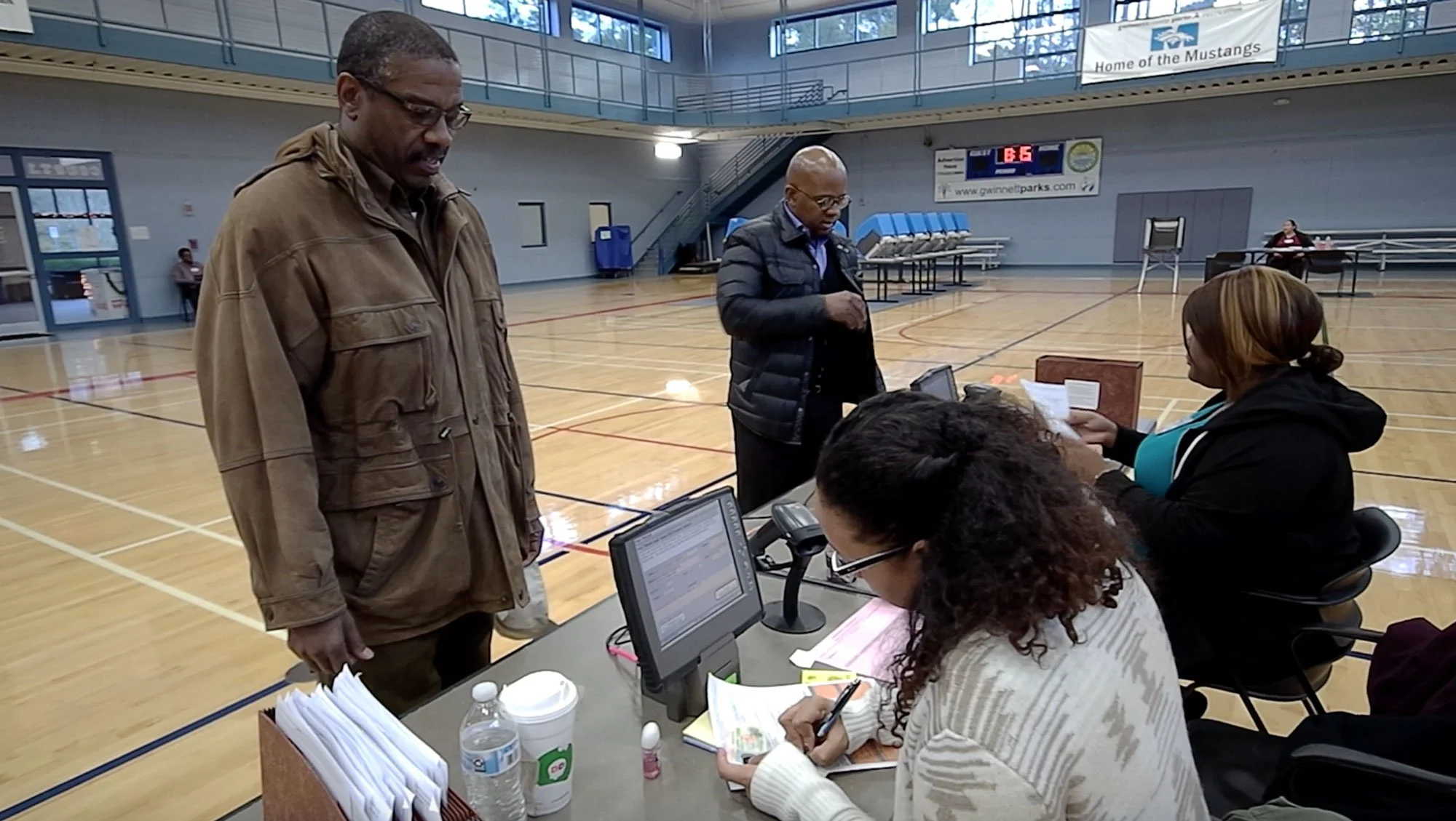 Georgia’s secretary of state runoff highlights voting obstacles for minorities