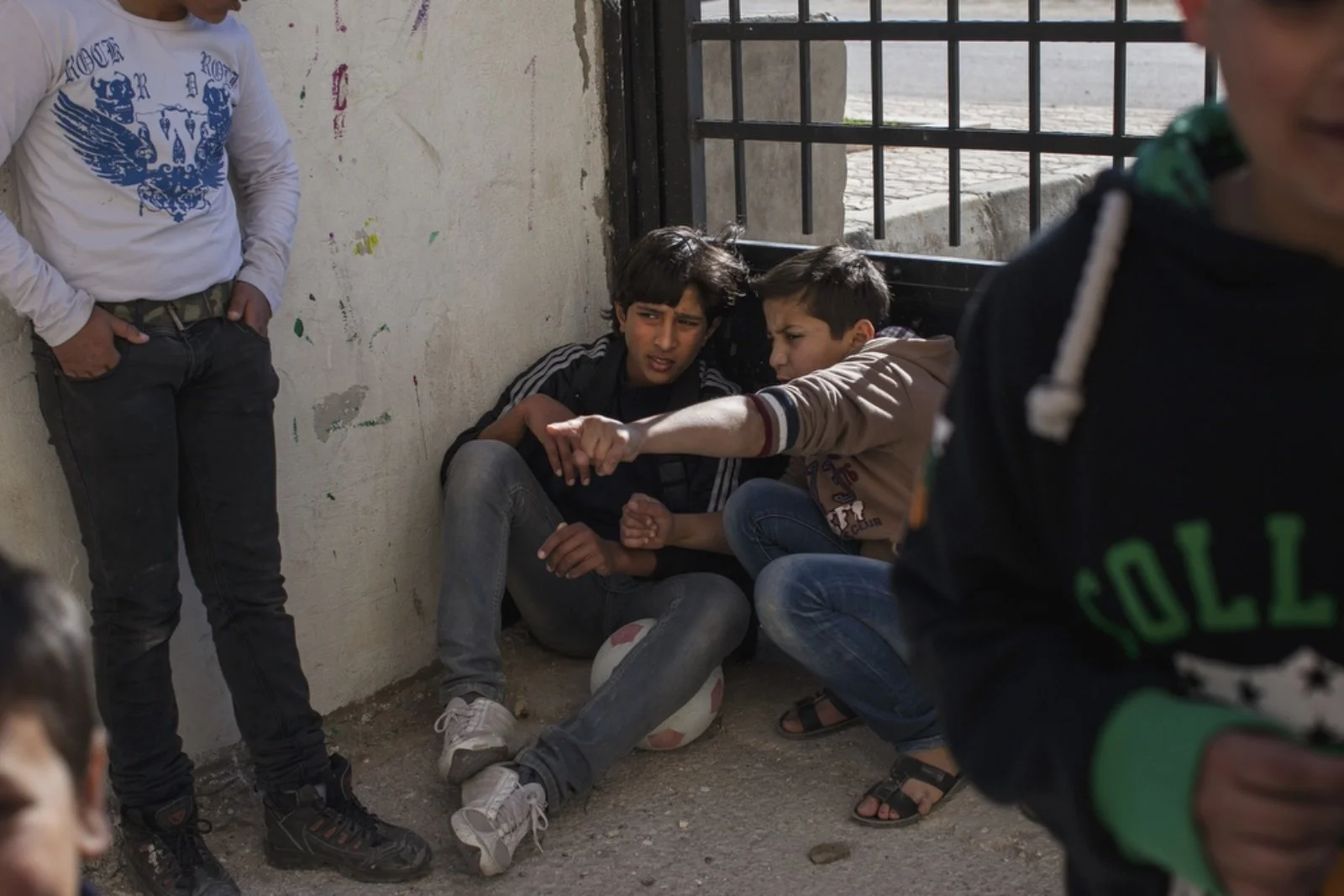  Young boys play outside of Dar Al-Ihsan For Orphans. Of the 112 children Dar Al-Ihsan houses, 100 are Syrian refugees. (Christopher Lee/GroundTruth) 
