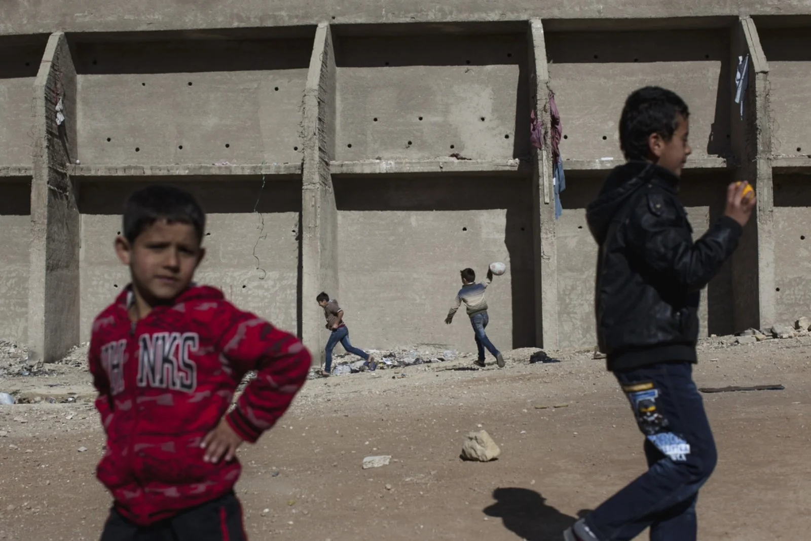  Young boys play with a soccer ball outside of Dar Al-Ihsan For Orphans (Christopher Lee/GroundTruth) 