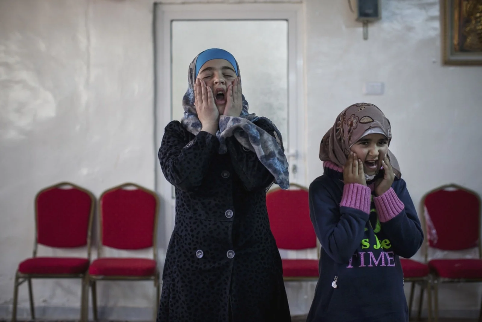  Rama (right), 12, a Syrian refugee from Daraa plays with her peers at Dar Al-Ihsan For Orphans on January 16, 2016.(Christopher Lee/GroundTruth) 