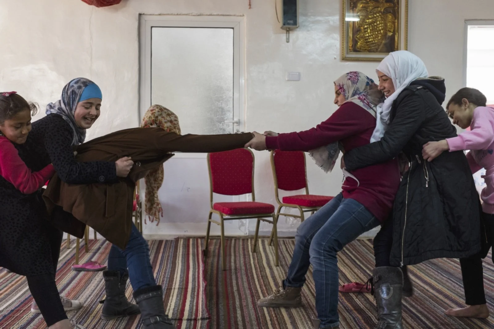 Young girls played in the community center room of Dar Al-Ihsan For Orphans on January 16, 2016. (Christopher Lee/GroundTruth) 