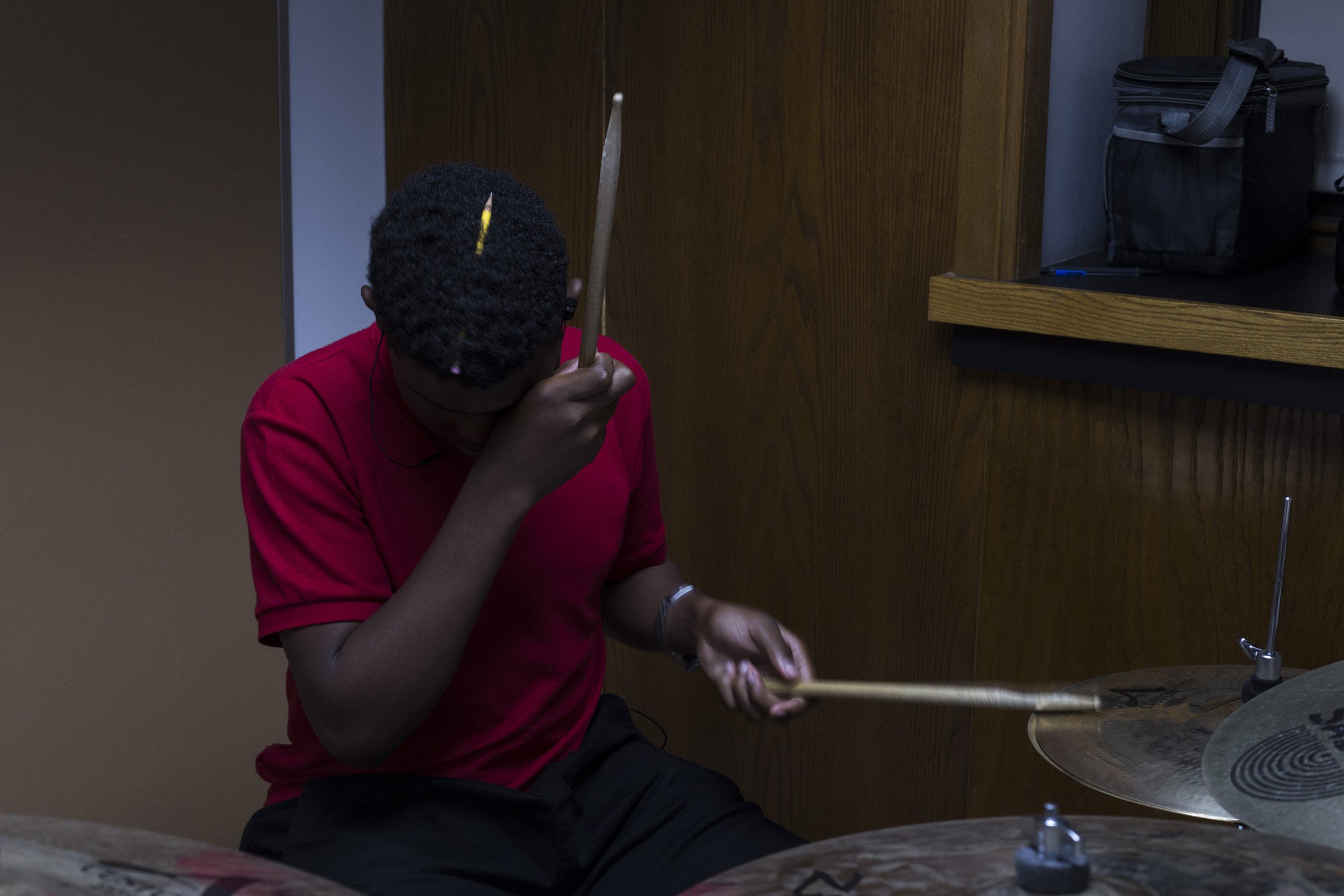  Holding a pencil in his hair, a student plays the drums in sequence with his classmates during jazz band at the High School of Commerce in Springfield, Mass., on Monday, September, 11, 2017. (Photo by Brittany Greeson) 