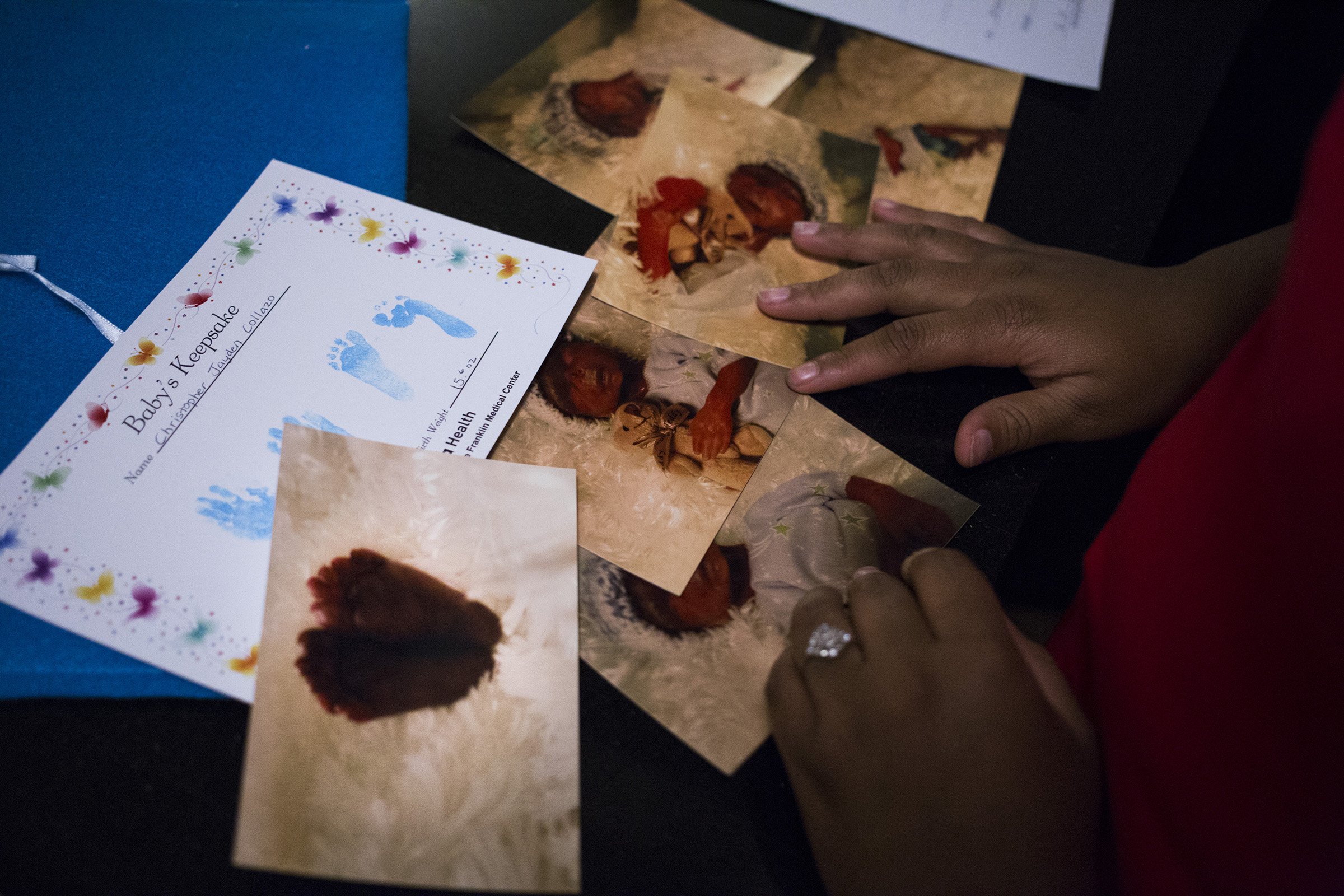  A student is reflected in a poster showing the student faces of the High School of Commerce within the building’s likeness in Springfield, Mass., on Friday, September, 8, 2017. (Photo by Brittany Greeson) 
