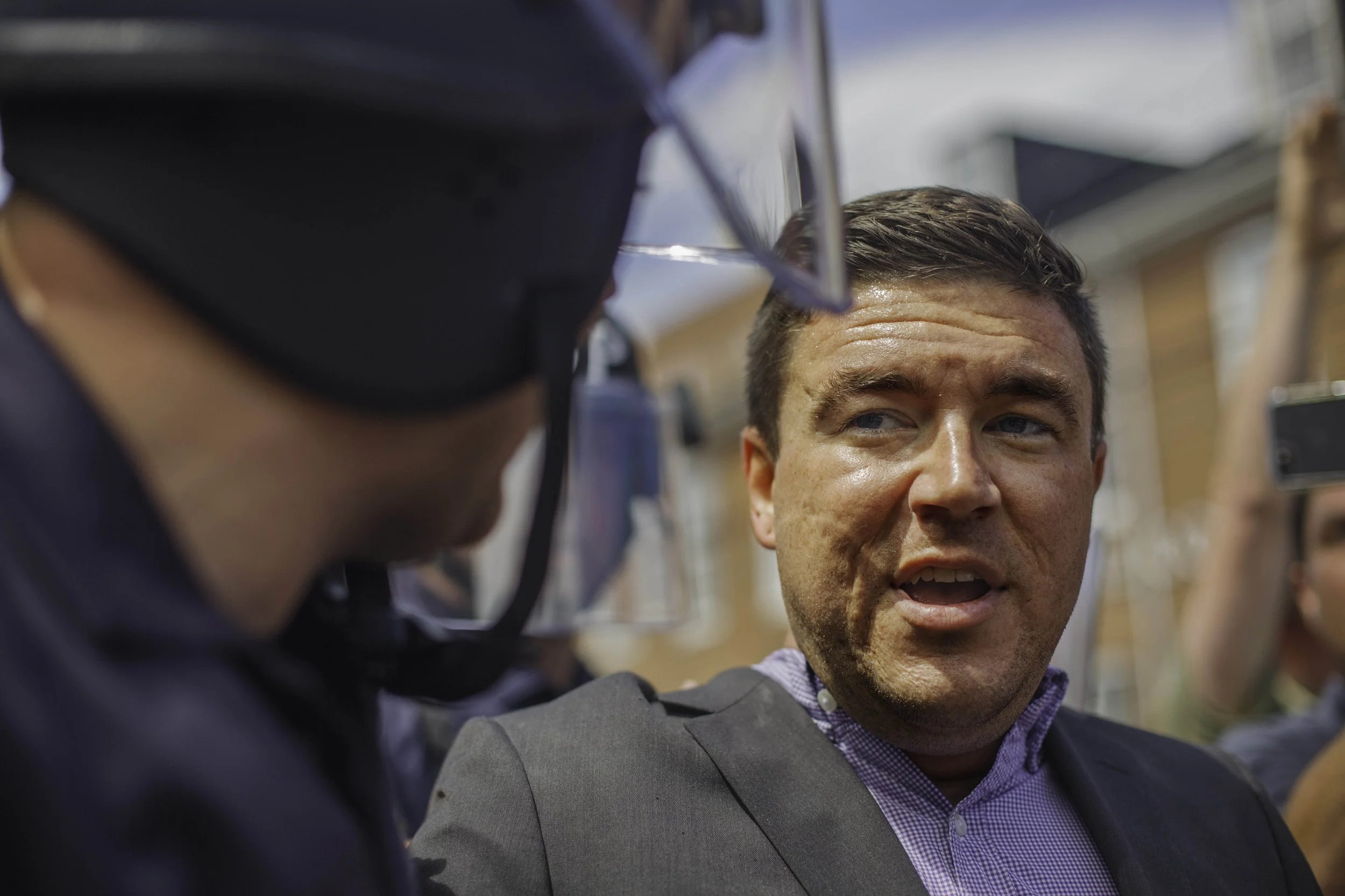  Jason Kessler, one of the main organizers of the Unite The Right rally, being escorted by riot police. Kessler attempted to hold a press conference to change the narrative of the prior days events before being chased away by counter protesters. Augu