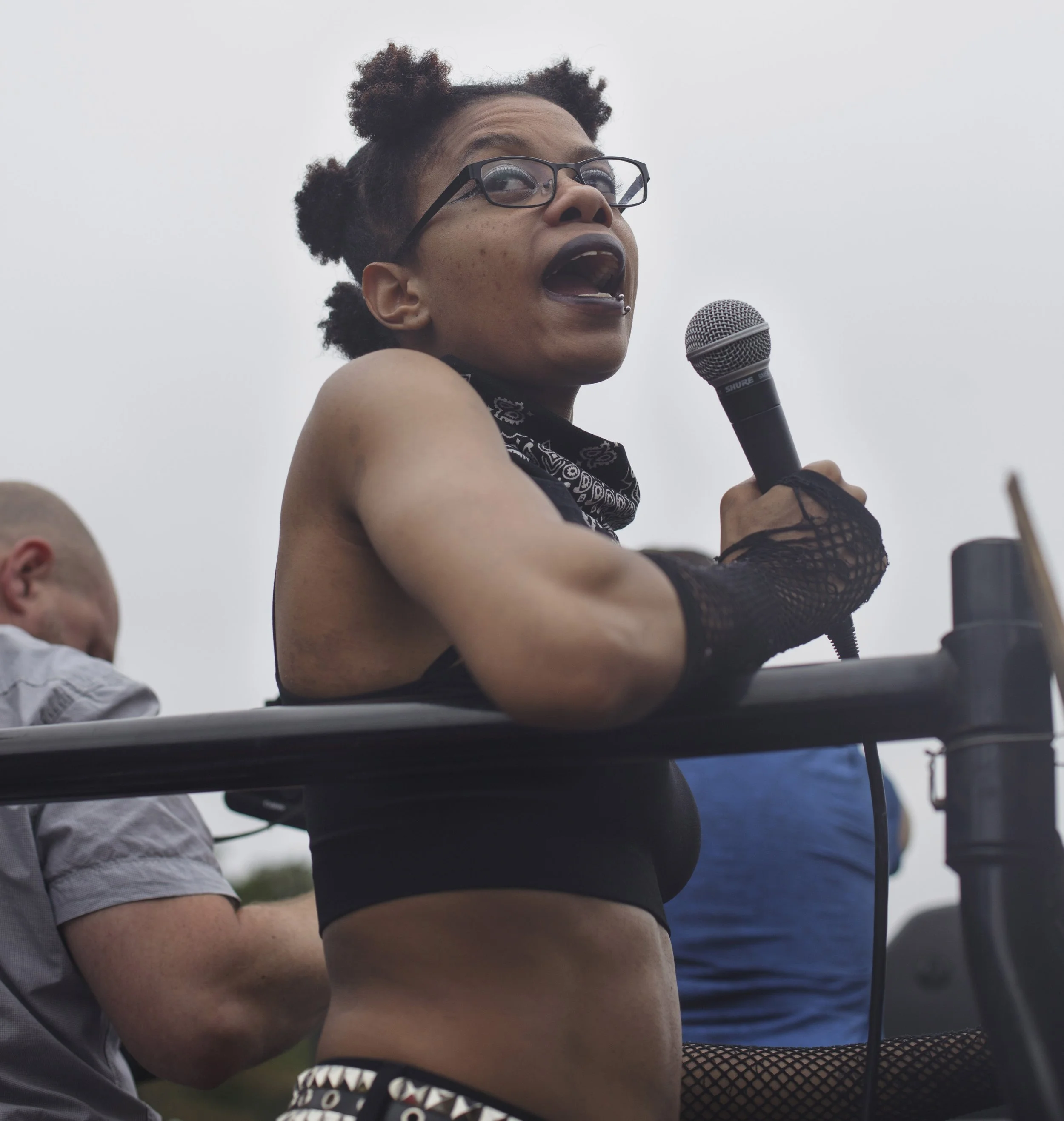  A counter protester leads a chant on top of a van with loud speakers. The protesters were demonstrating agains the Free Speech Rally happening at the Boston Common on August 19, 2017. (Shay Horse/GroundTruth) 