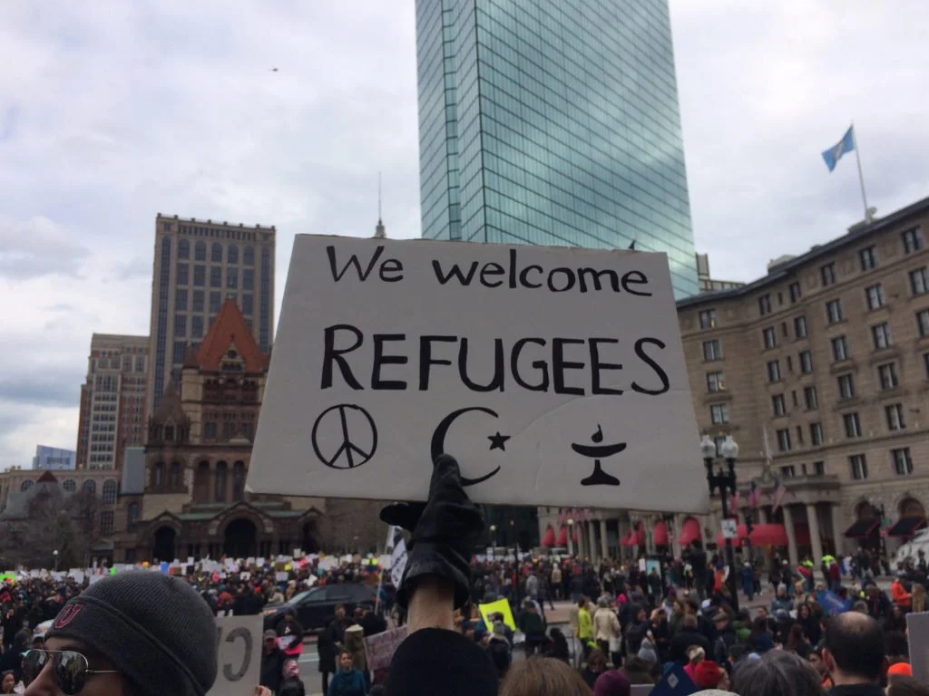  A sign reads “We welcome refugees” at a demonstration in Boston’s Copley Square on January 29, 2017. (Photo by Giulia Afiune/GroundTruth) 
