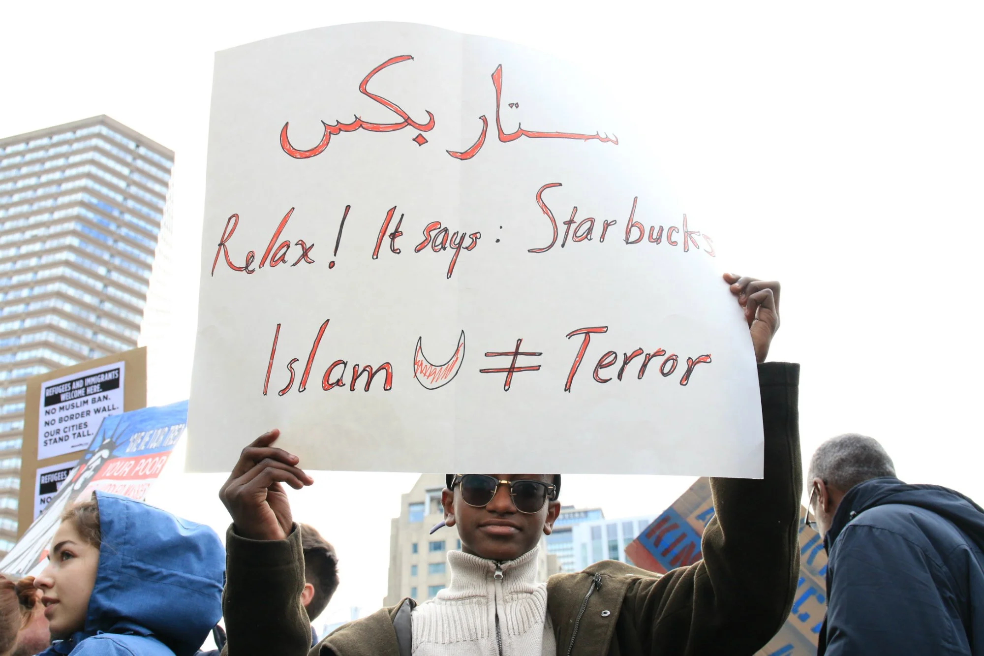  Ahmed Akoad, 12, attends a protest against President Donald Trump’s immigration order in Boston’s Copley Square, on Jan. 29, 2017. Akoad is American but his parents, who were also at the protest, are from Sudan, one of the seven majority-Muslim coun