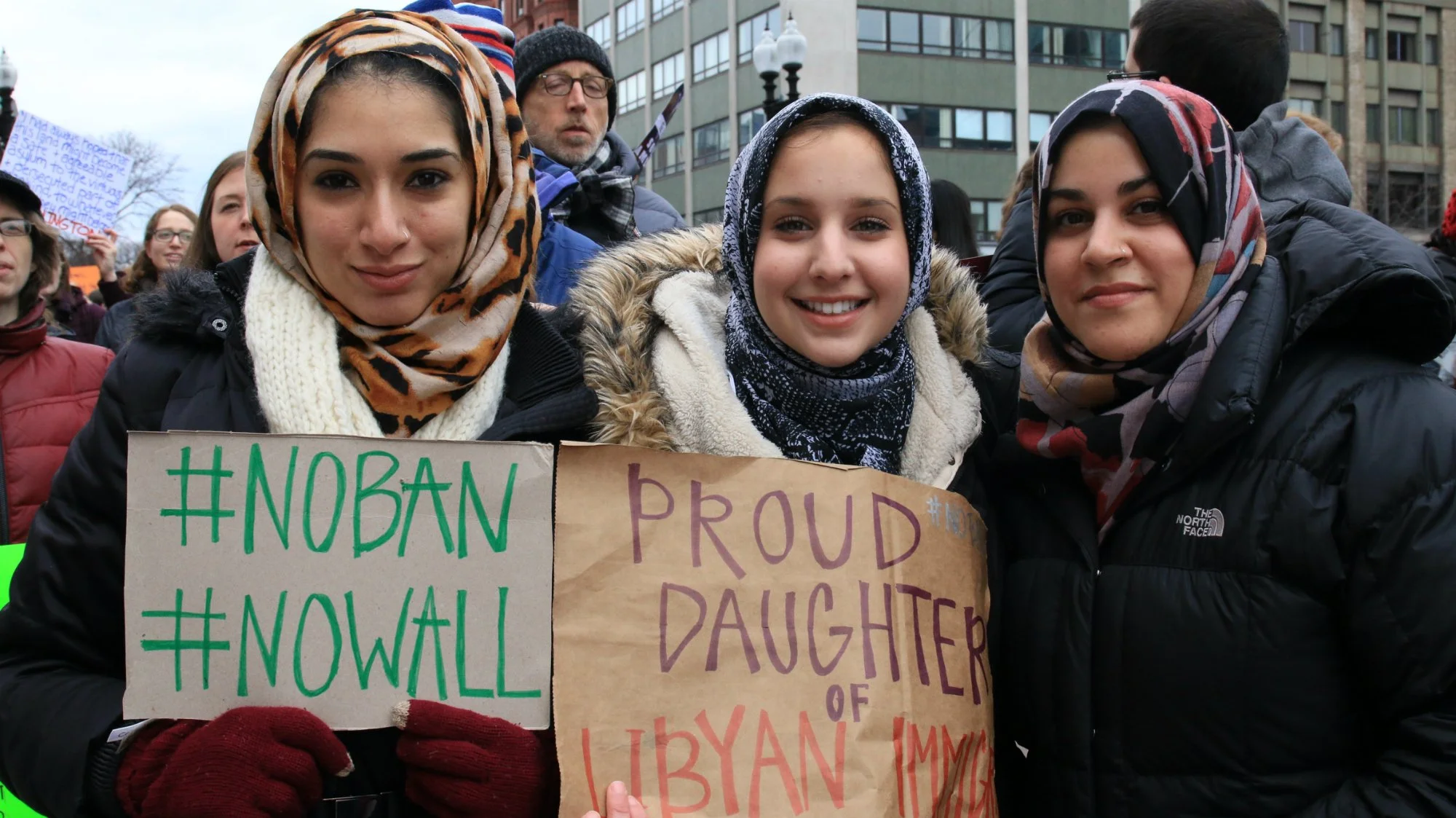  From left: Jasmin Riad, Noor Traina and Zara Majidi protested against President Donald Trump’s executive order in Boston’s Copley Square on Jan. 29, 2017. (Photo by Giulia Afiune/GroundTruth) 
