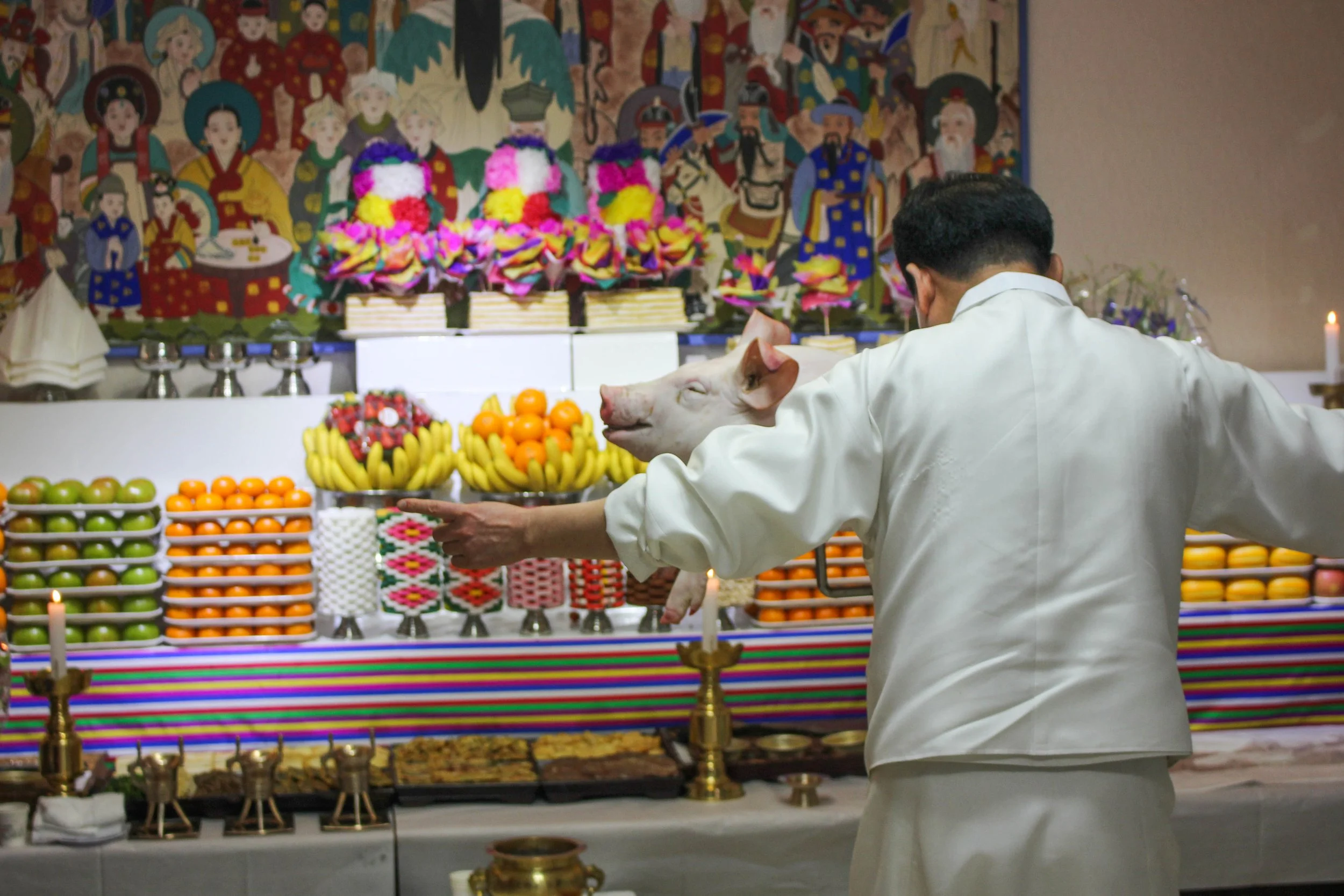 The pig was blessed before the official offering. This made the animal not only helpful for Choi, but also for anyone who ate it afterwards. (Miranda Mazariegos/GroundTruth) 