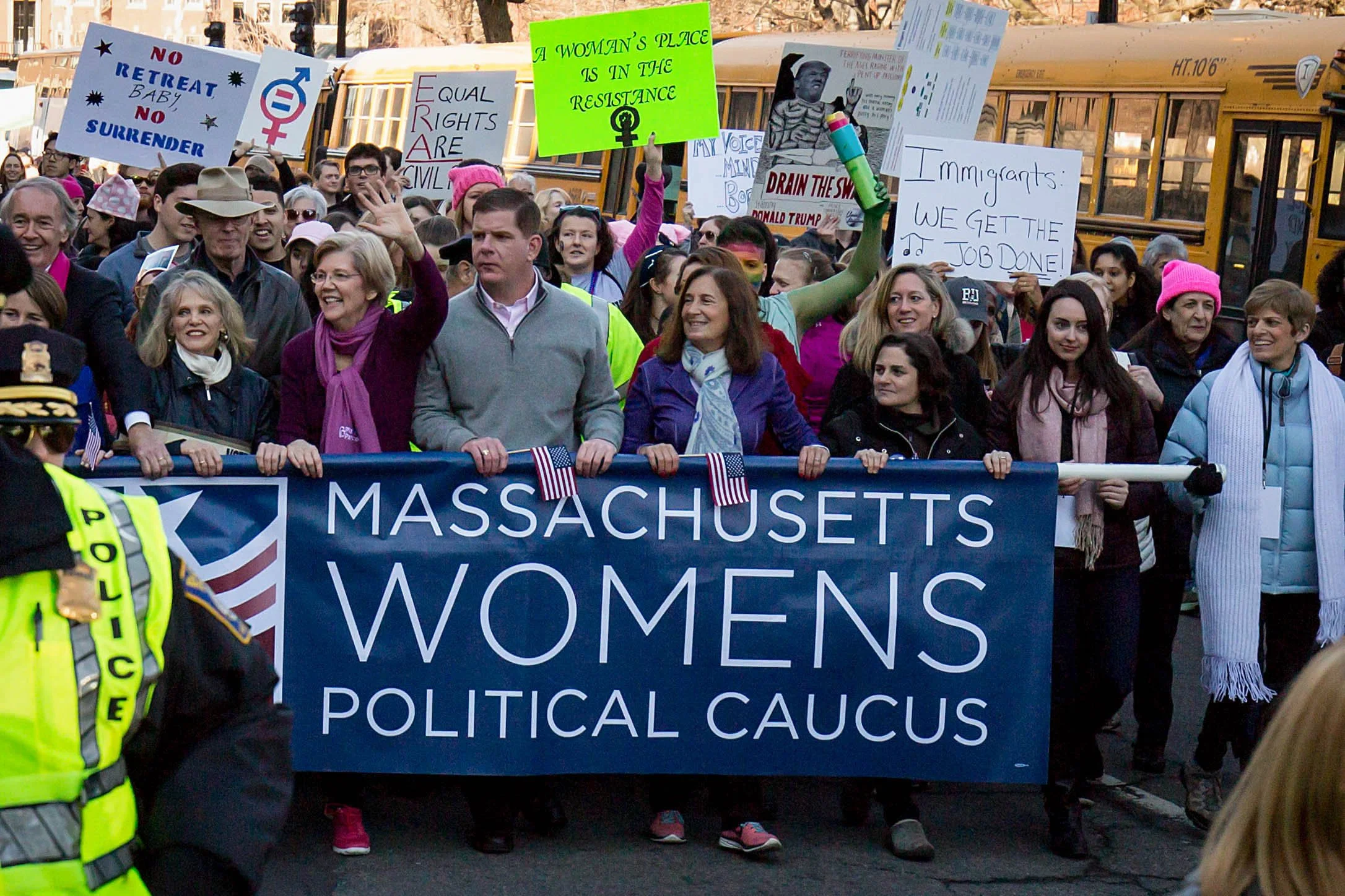  Boston Mayor Marty Walsh and Sen. Elizabeth Warren march with women holding up a sign for the Massachusetts Womens Political Caucus on Jan. 21, 2017. (Photo by Alastair Pike) 
