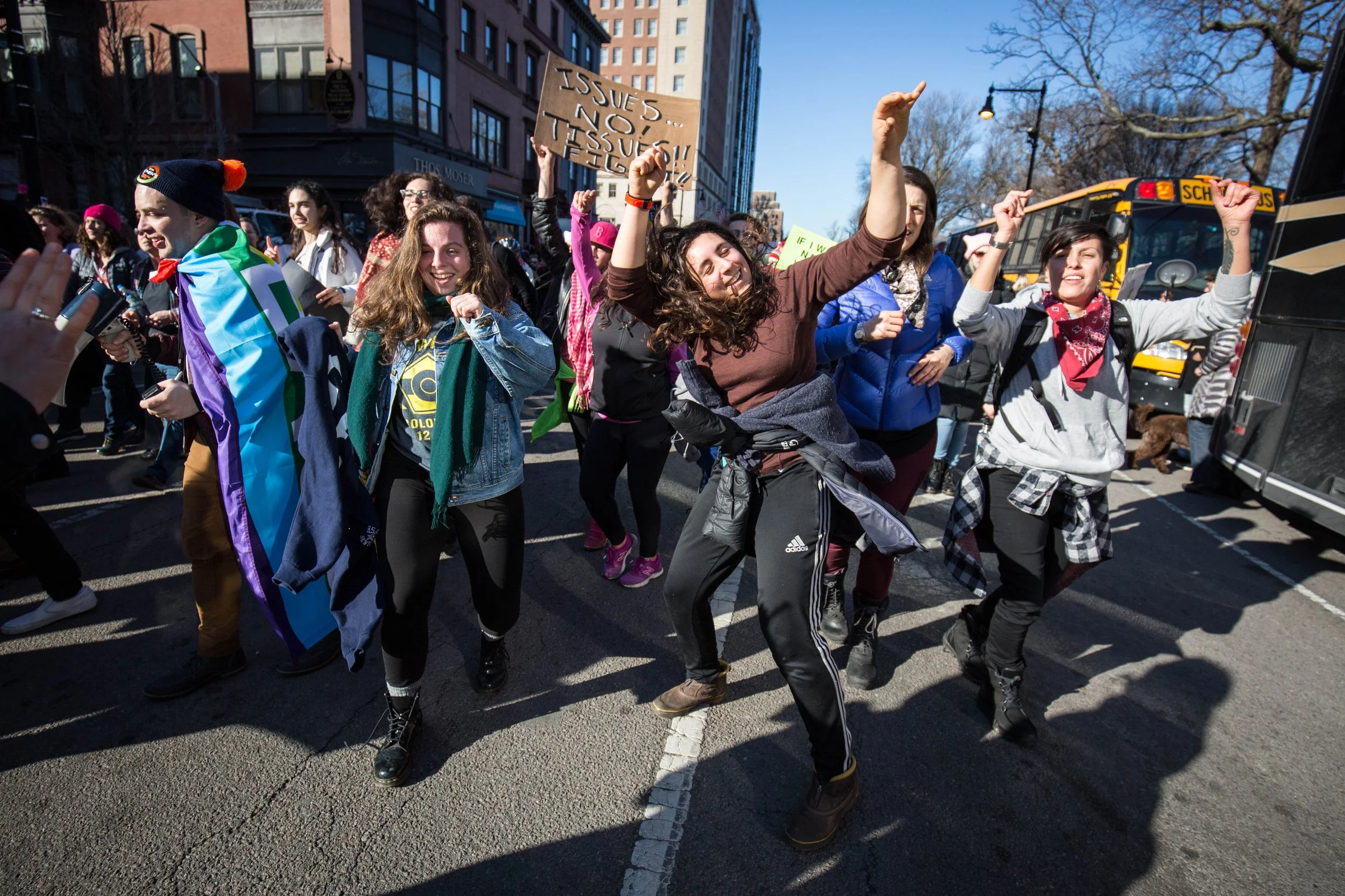  Marchers follow a band and dance in the streets during the Boston Women’s March on Jan. 21, 2017. (Photo by Alastair Pike) 