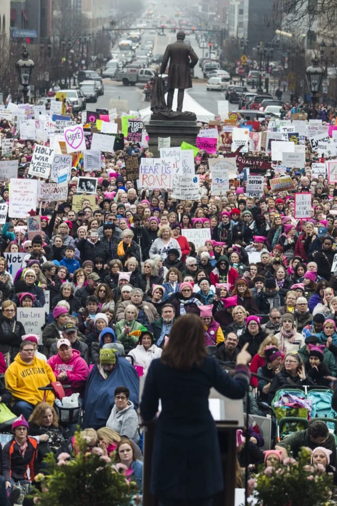   Michigan gubernatorial candidate Gretchen Whitmer speaks to a crowd of thousands outside of the Michigan State Capitol Building for the Women’s March on Lansing in Lansing, Mich., on Saturday, January 21, 2017. (Photo by Brittany Greeson/GroundTrut