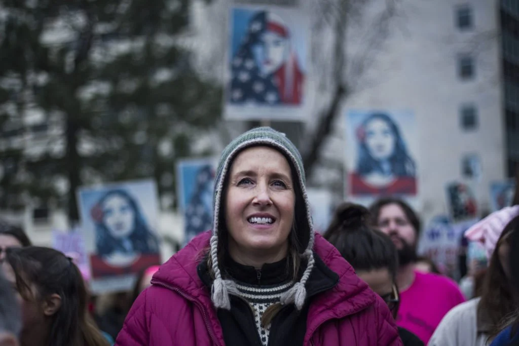   Jennifer Day, 49, of Ann Arbor, listens to speakers for the Women’s March on Lansing outside of the Michigan State Capitol Building in Lansing, Mich., on Saturday, January 21, 2017. “I’m definitely feeling inspired. I want to put a voice to what ki