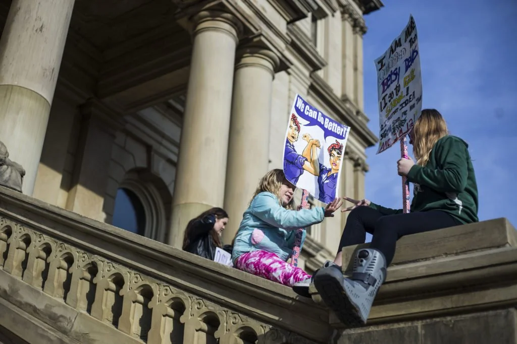   Thousands gather outside of the Michigan State Capitol Building for the Women’s March on Lansing in Lansing, Mich., on Saturday, January 21, 2017. (Photo by Brittany Greeson/GroundTruth)  