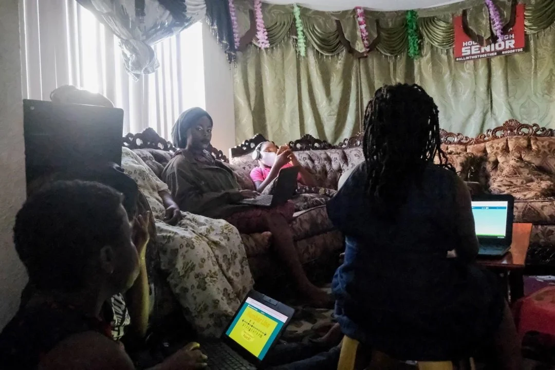  Consolata Shabani, 38, attends a Zoom ESL class from her living room. Shabani says it’s more difficult to understand the class on Zoom and feels more comfortable asking questions in person. (Photo by Aryana Noroozi/GroundTruth) 