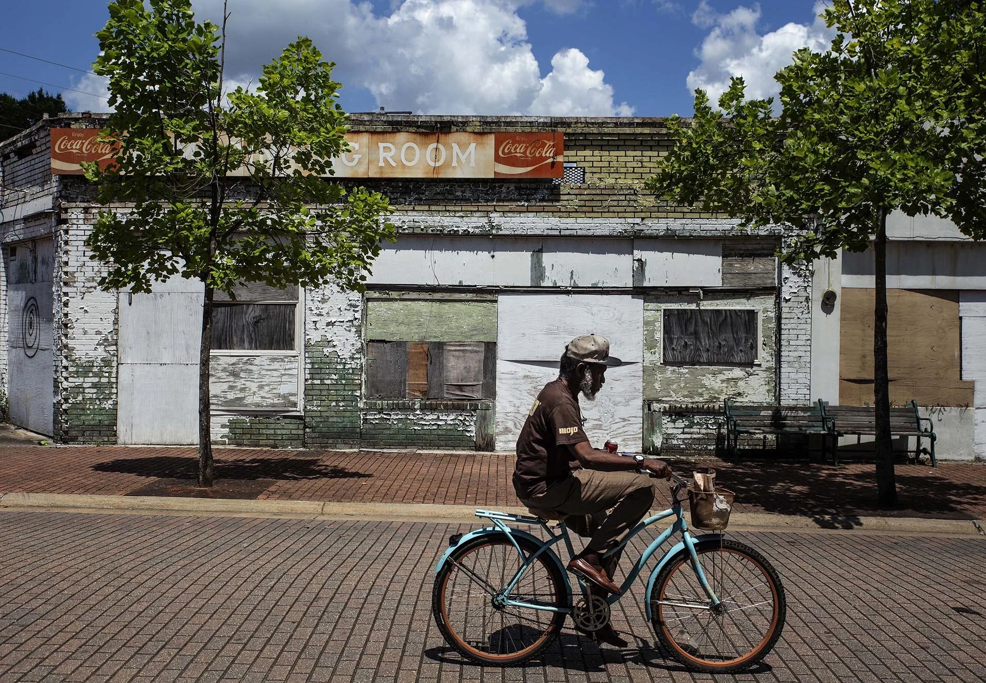 A pedestrian rides his bicycle in the 300 block of Farish Street in Jackson Wednesday, June 27, 2018. (Photo by Eric J. Shelton/GroundTruth) 