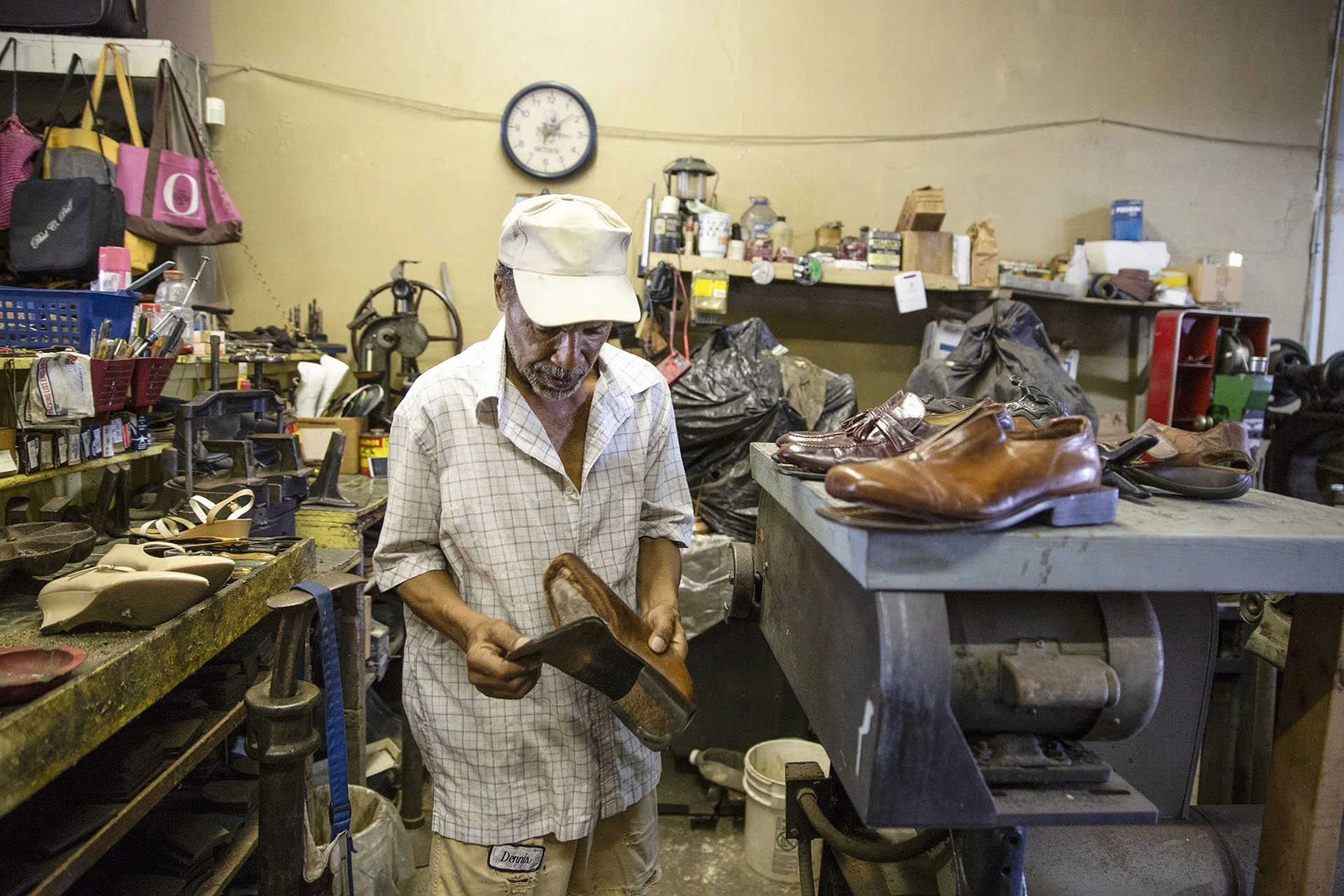 Tony “Dr. Shoemaker” Brothers works on a customer’s shoes at his family’s business, Dennis Brothers Shoe Repair Service, in the 300 block of Farish Street in Jackson Wednesday, June 27, 2018. (Photo by Eric J. Shelton/GroundTruth) 