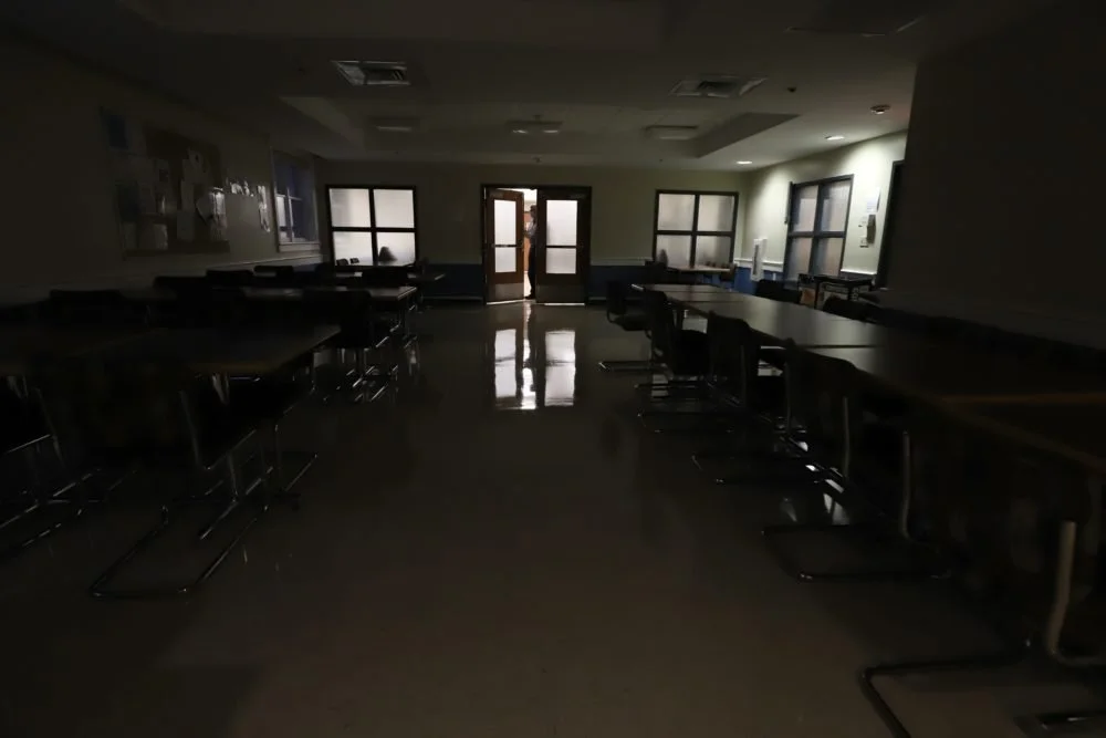  The lights are shut off in the dining area of Columbus House. Most staff members work remotely and many people experiencing homelessness are moved to hotels and housing in New Haven. (Photo by Chris Ehrmann/GroundTruth) 
