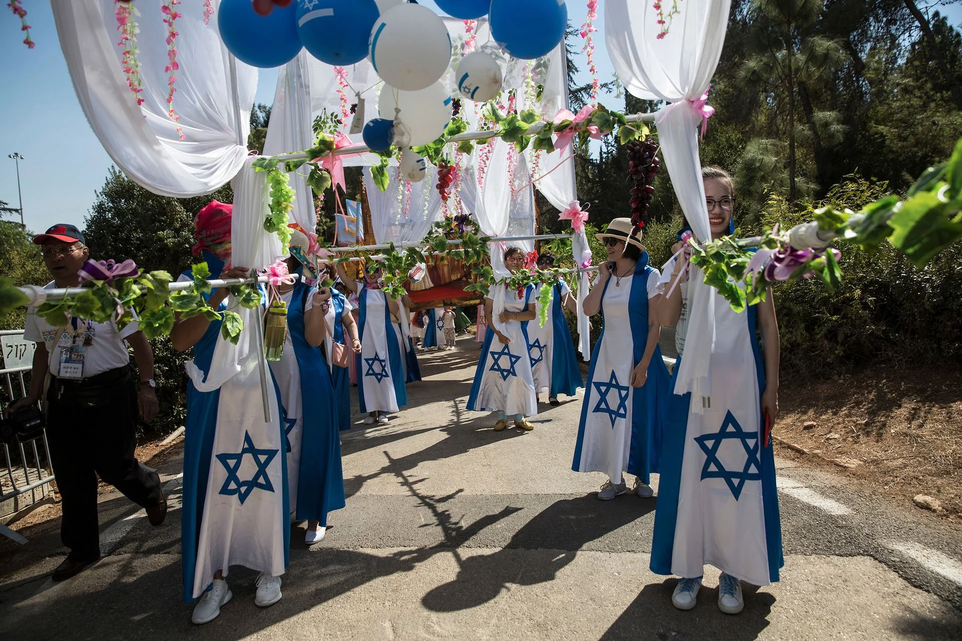 Christian pilgrims from China participate during a parade in Jerusalem on September 27,2018. Thousands of Christians from around the world came to Jerusalem for the week long Feast of Tabernacles, also known as Sukkot. (Photo by Heidi Levine for The 