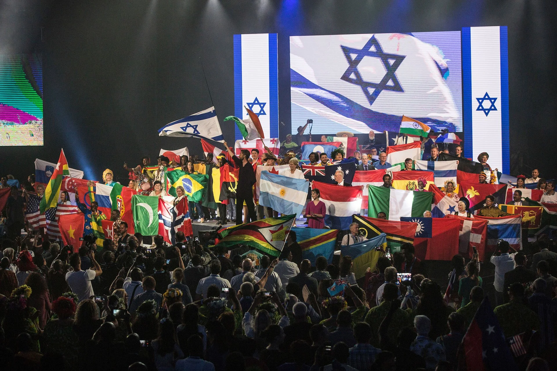 Thousands of Evangelical Christian pilgrims from around waving their national flags gathered for the Parade of Nations and opening ceremonies for the 2018 Feast of Tabernacles on September 24,2018 at the Pais Arena in Jerusalem. (Photo by Heidi Levin