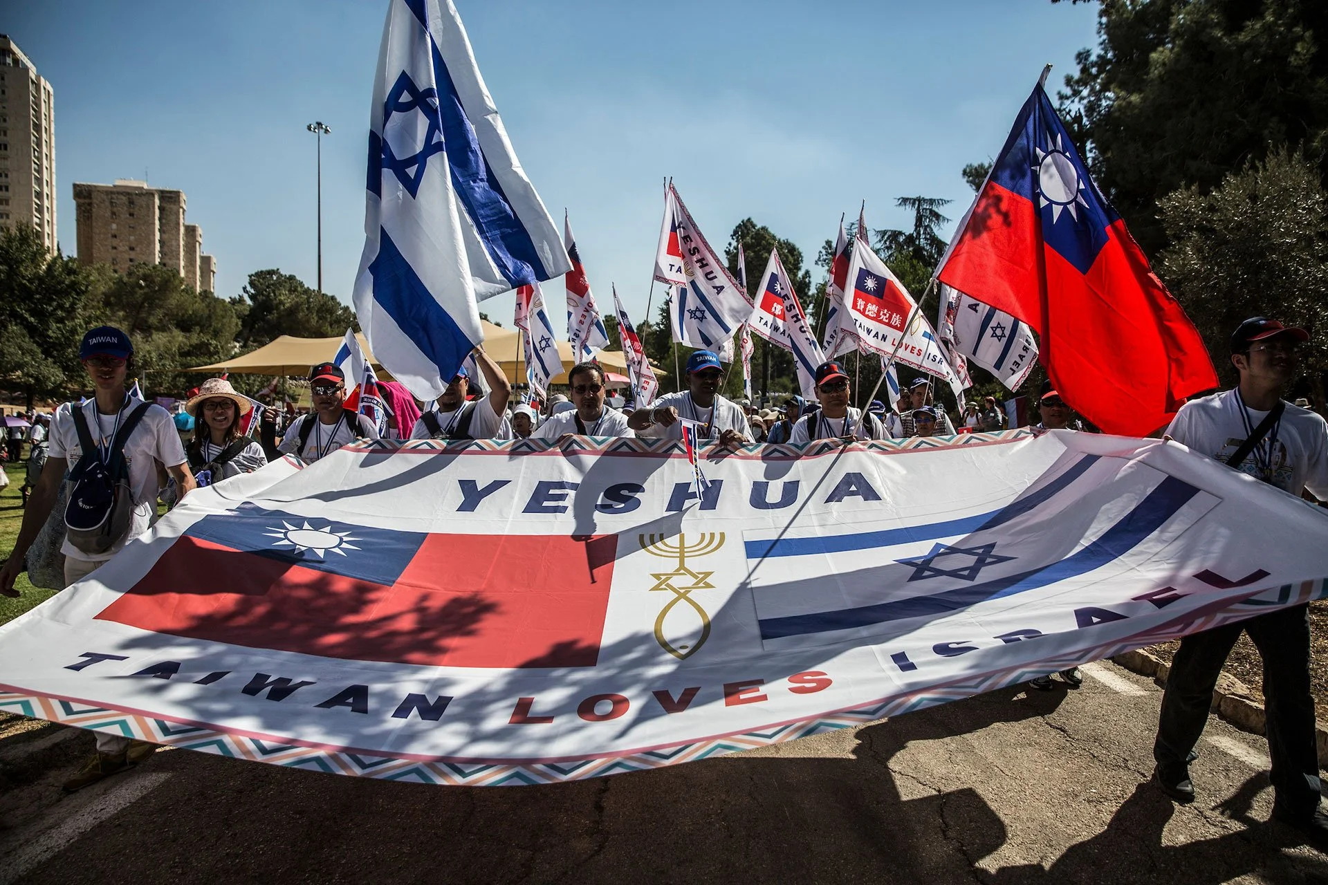 Christian pilgrims from Taiwan participate during a parade in Jerusalem on September 27,2018. Thousands of Christians from around the world came to Jerusalem for the week long Feast of Tabernacles, also known as Sukkot. (Photo by Heidi Levine for The