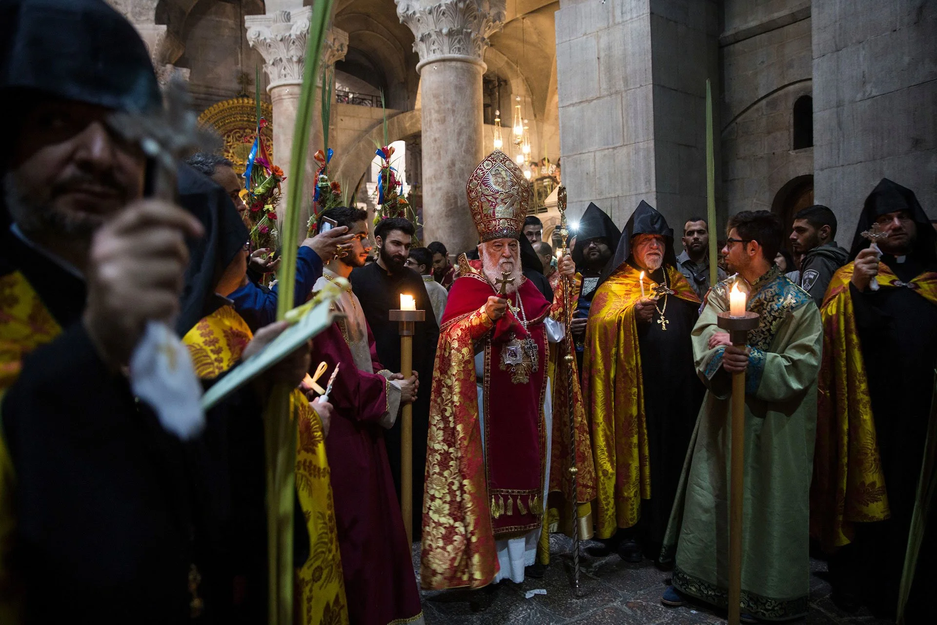 Orthodox Christian worshipers from around the world inside the Church of the Holy Sepulcher on Palm Sunday in the Old City of Jerusalem on April 1,2018.Hundreds of Orthodox Christians joined clergymen, holding palm fronds and olive tree branches as t