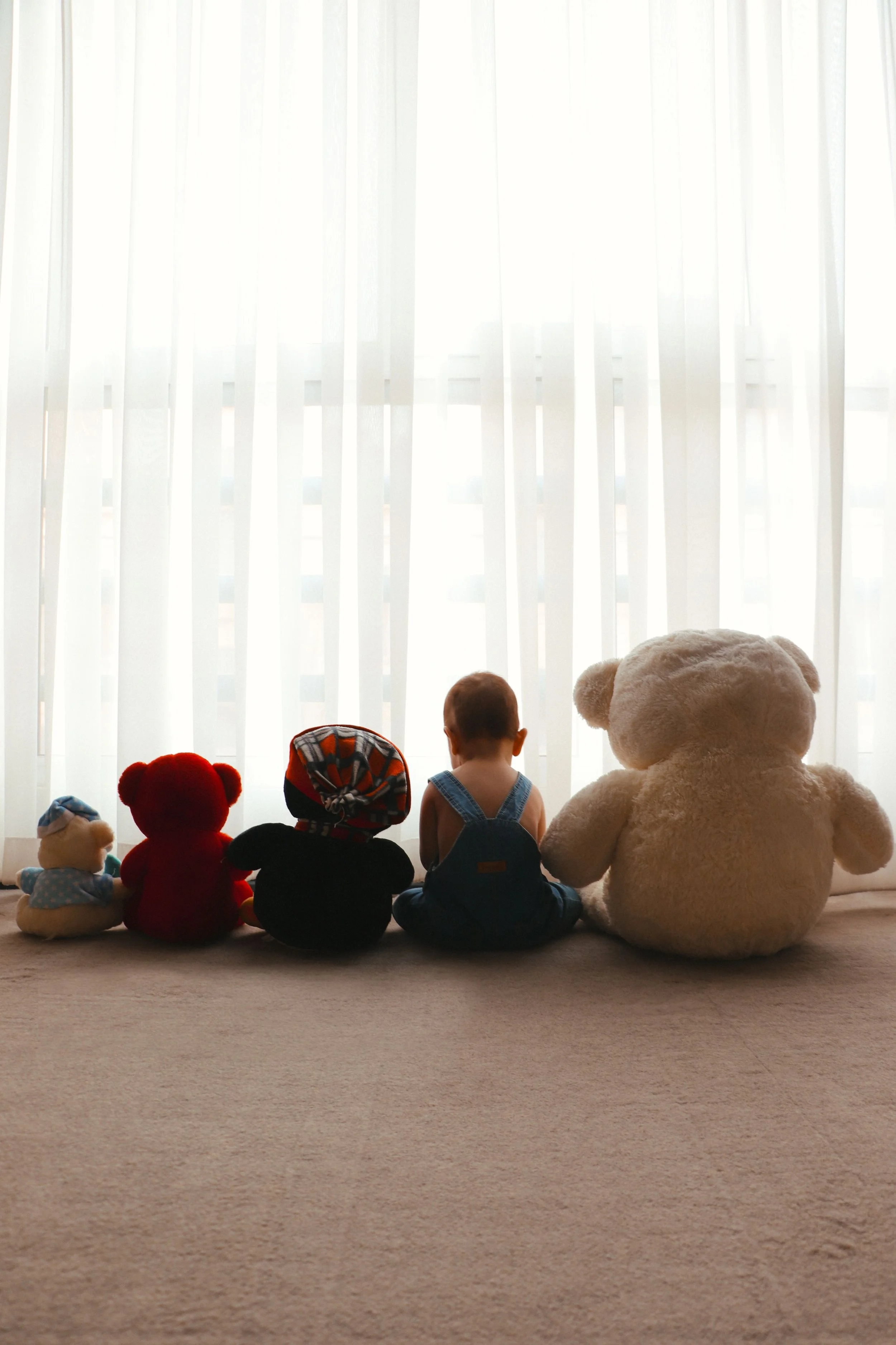 A young child with their toys as a representation for parent support therapy