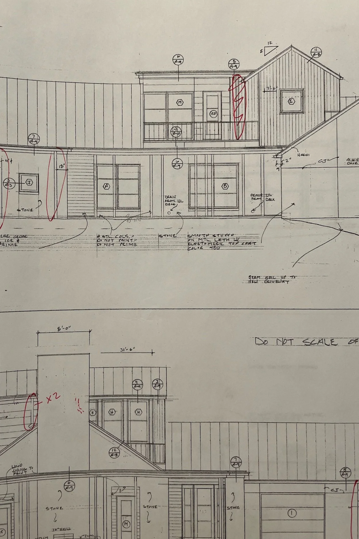 Architectural blueprint drawing of a multi-story residential building with detailed measurements, window placements, and construction notes.