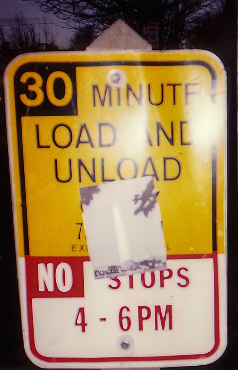 Monuments, photocopied poster on 30 minute load and unload sign, Downtown Seattle, 1993.